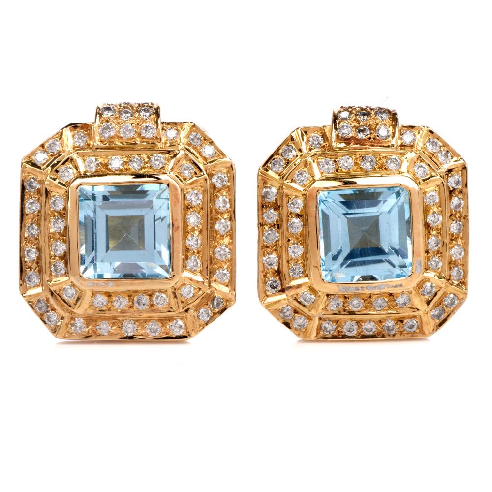 These fashionable blue topaz and diamond square stud earrings are crafted in solid 18-karat yellow gold. Showcasing a pair of prominent centered Squaure  bezel set genuine blue topaz weighing approx. 4.10 carats. Surrounded by a double halo of prong