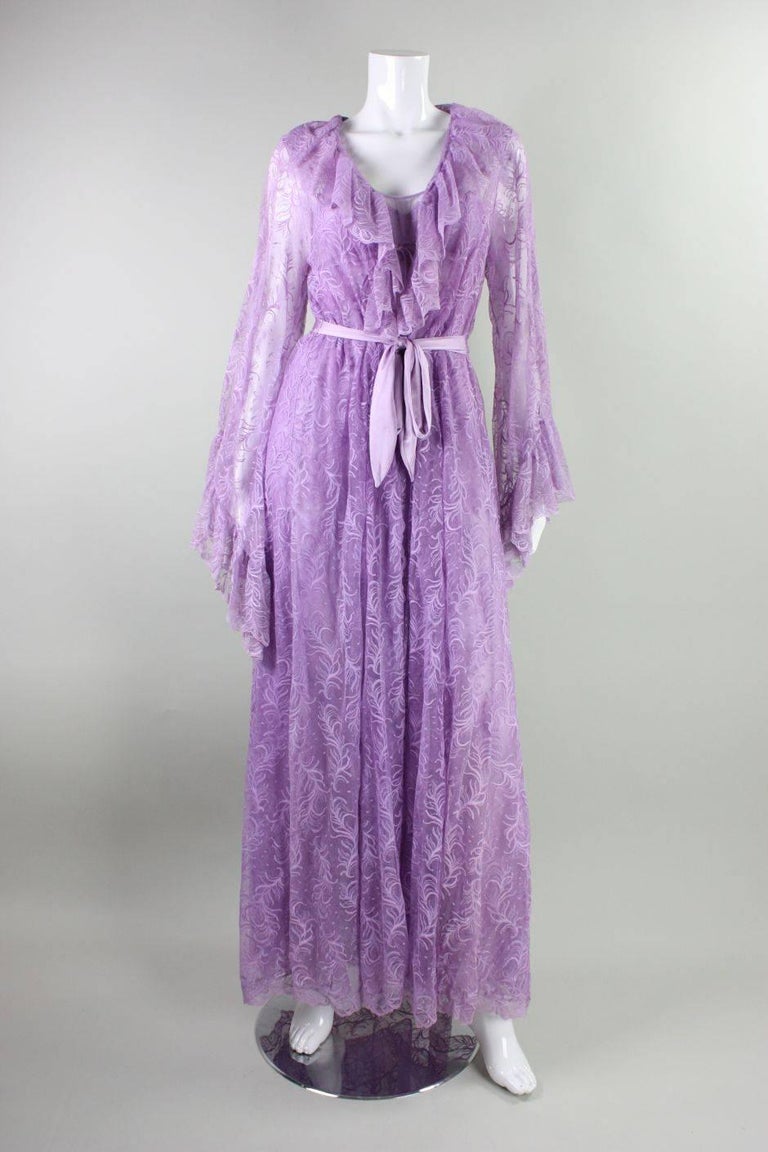 Vintage peignoir set from Bob Mackie from Glydons is made of lilac-colored nylon lace and dates to the 1980's.  Long robe with scalloped collar features large bell sleeves and a detached waist tie.  Nightgown has empire waist, adjustable spaghetti