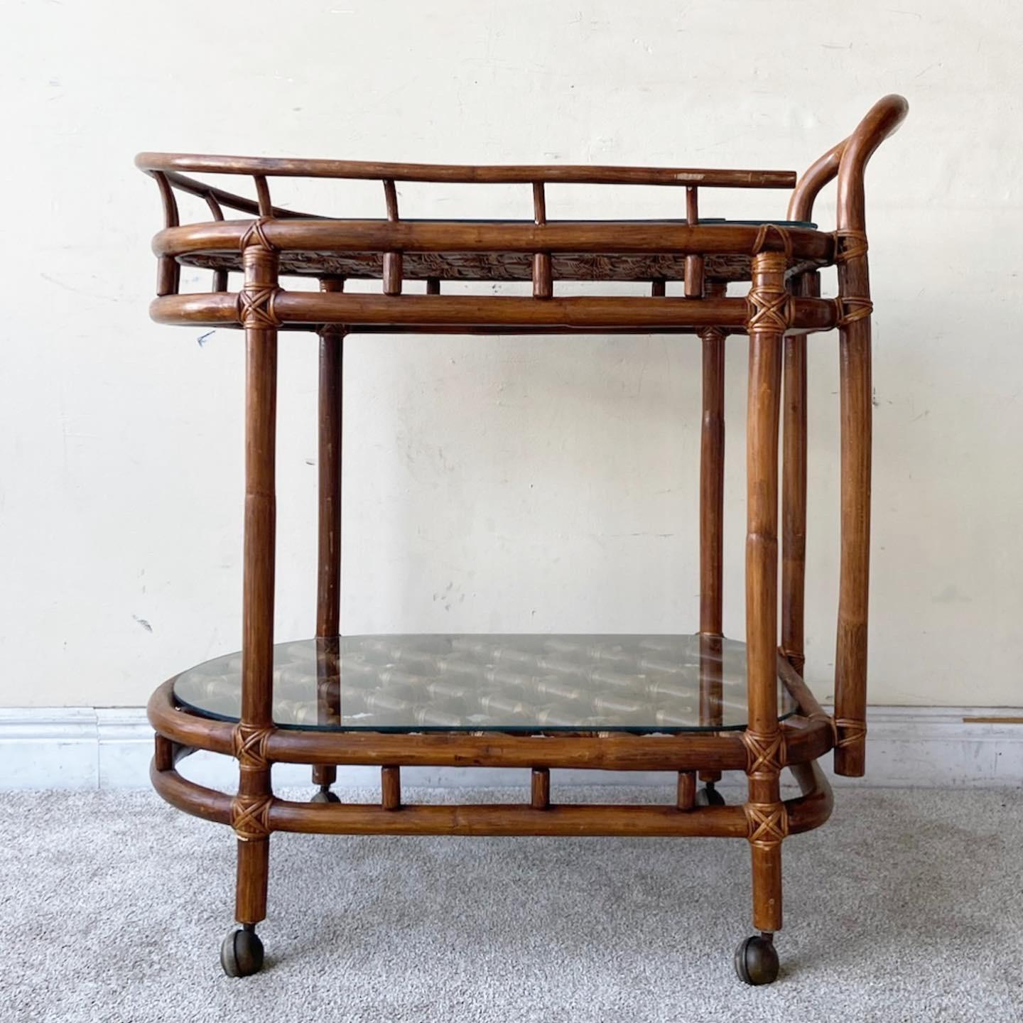 Excellent vintage bohemian bamboo rattan two tier bar cart. Features a fantastic latticed bamboo on each tier.
 