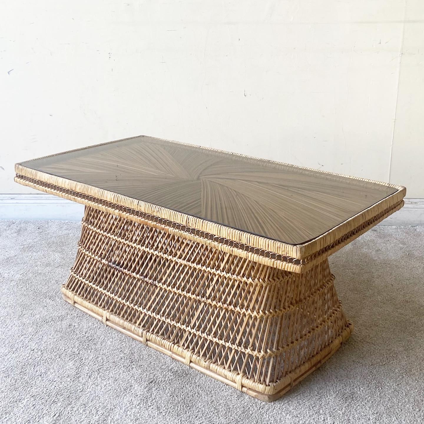 Exceptional vintage bohemian buri rattan rectangular codes table. Features an amazing even design with a smoked glass top.