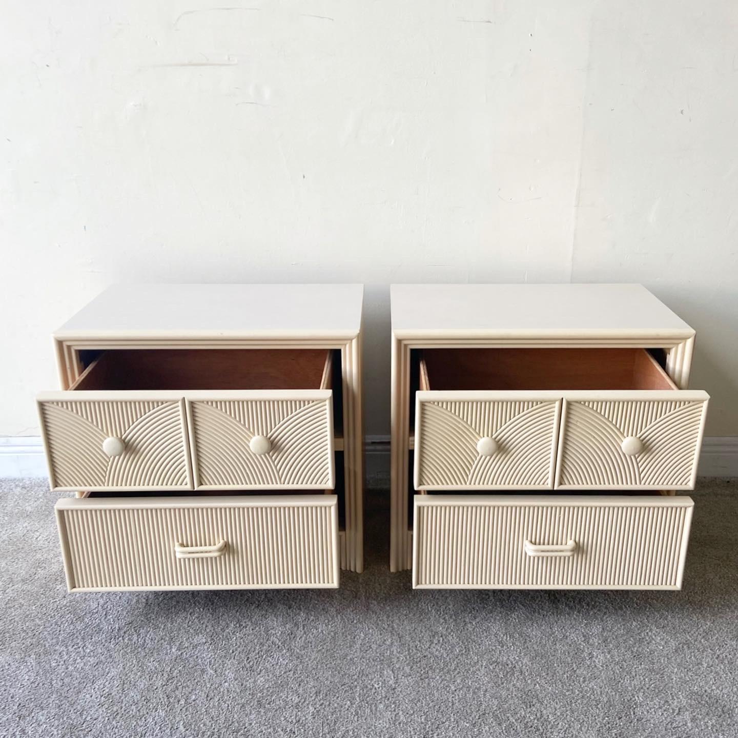Excellent pair of boho nighstands by Stanley Furniture Co. Features two spacious drawers with a pencil reed drawer face.
 
