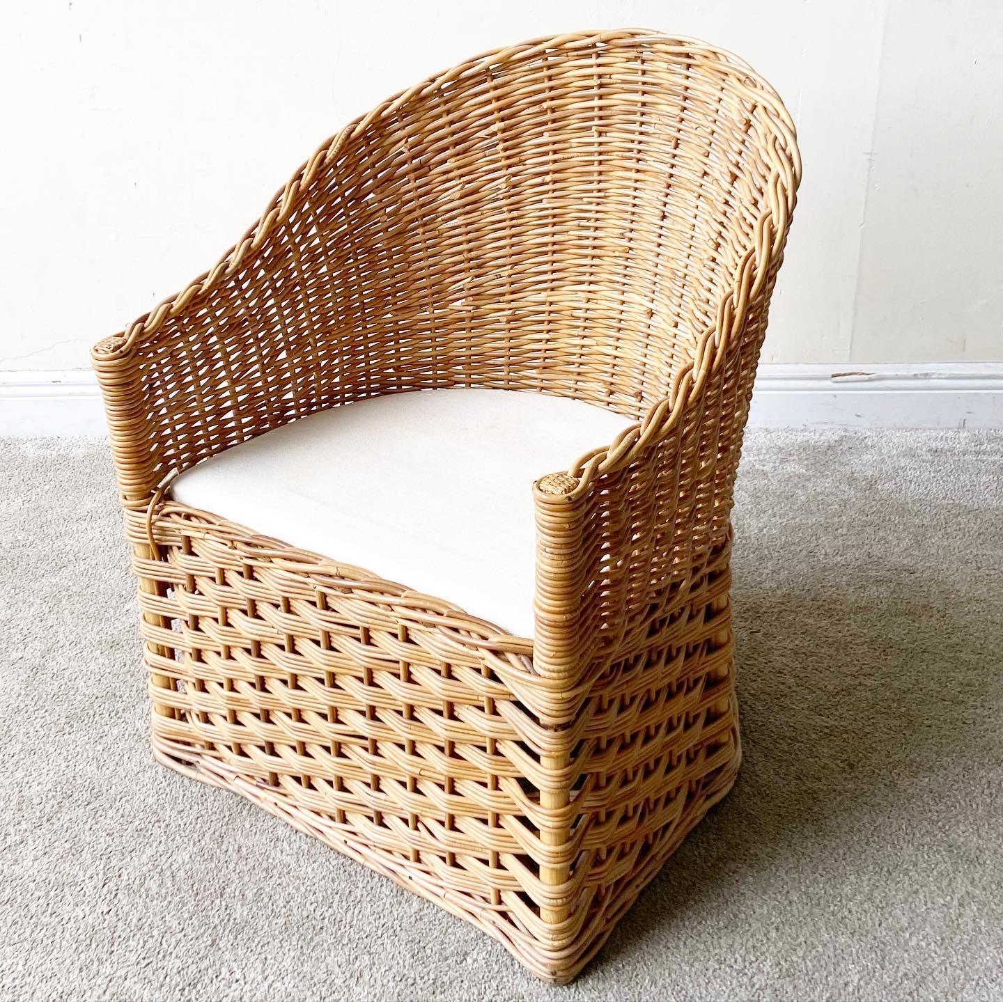 Incredible whicker woven barrel chair. Features white fabric cushions with a tufted back. Seat Height: 17.5 in
