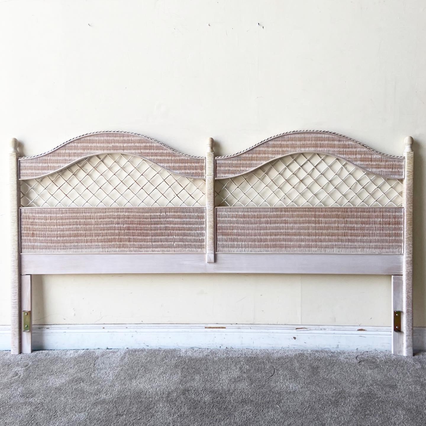 Exceptional boho chic king size headboard by Henry Link. Features a woven wicker and rattan throughout the frame.
  