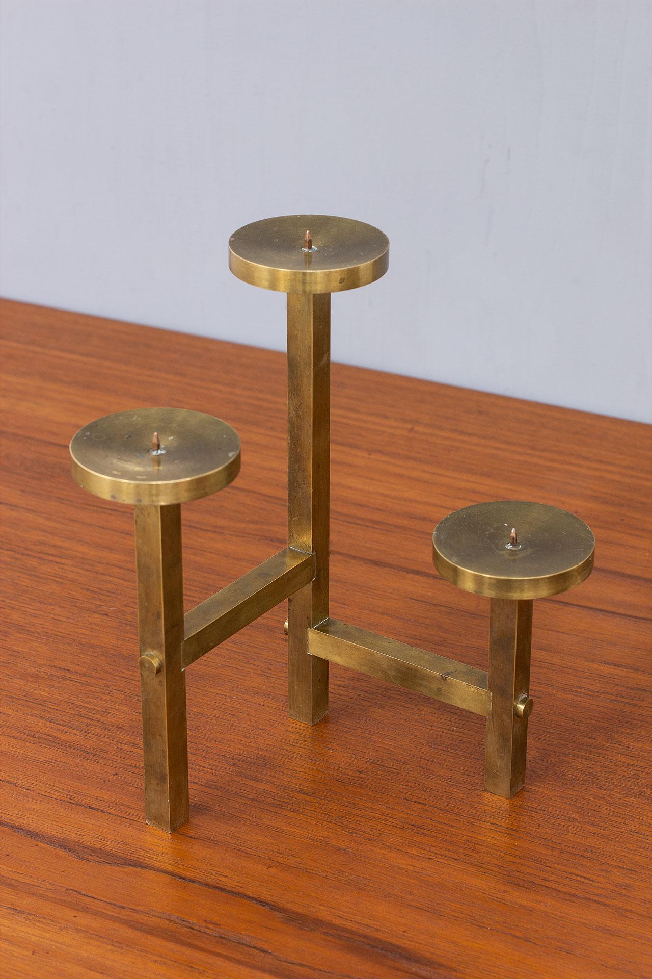Beautiful tripod brass candelabra from unknown maker.  Most likely manufactured in Sweden during the 1980s. 
Suitable for wide candles: Ø up to 7cm

Dimensions: H 24 x W 18 x D 18cm

Condition is very good with lovely patina.