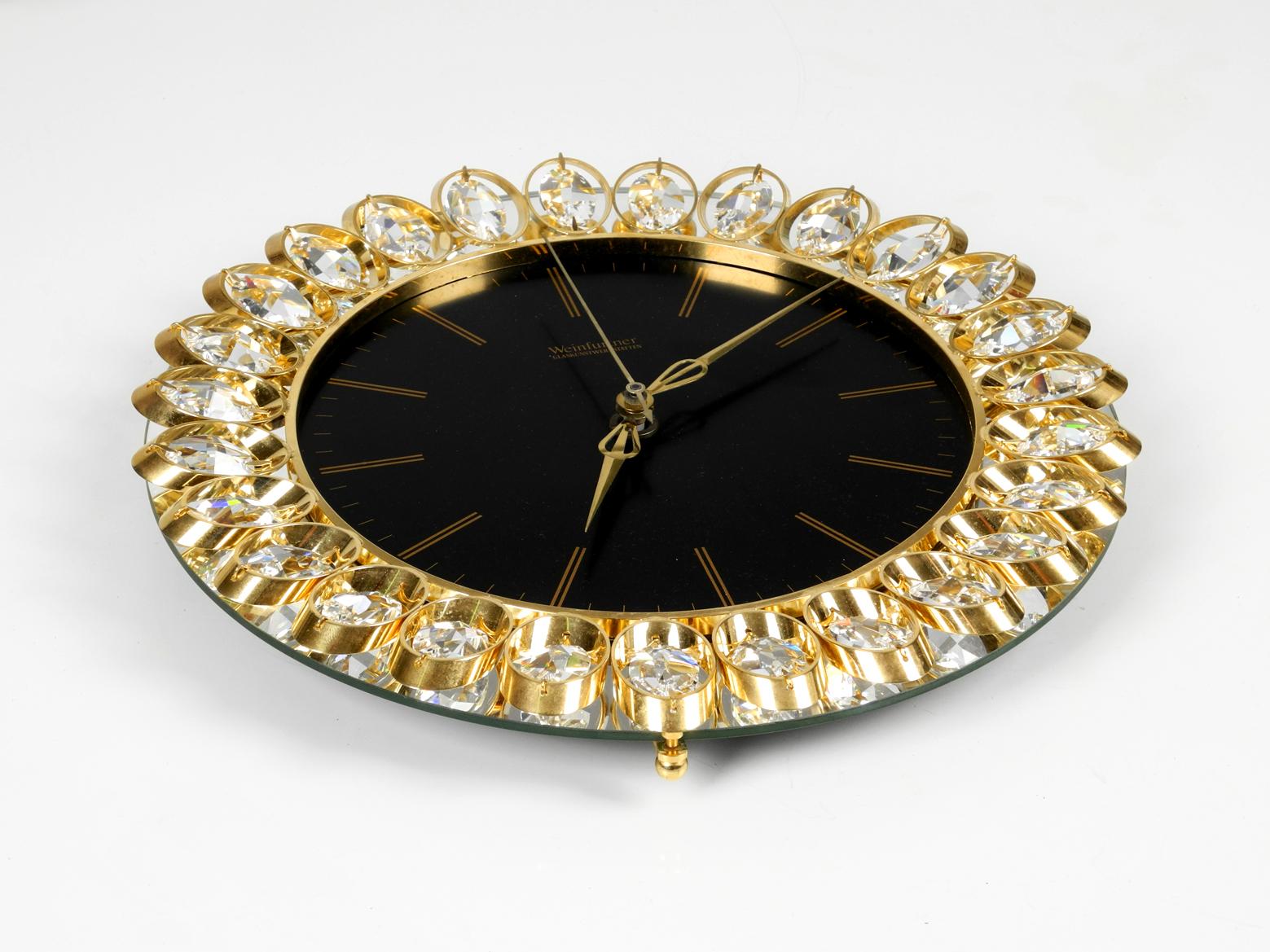 Gorgeous very rare 1980s brass crystal glass wall clock in the style of Hollywood Regency. Manufacturer is 