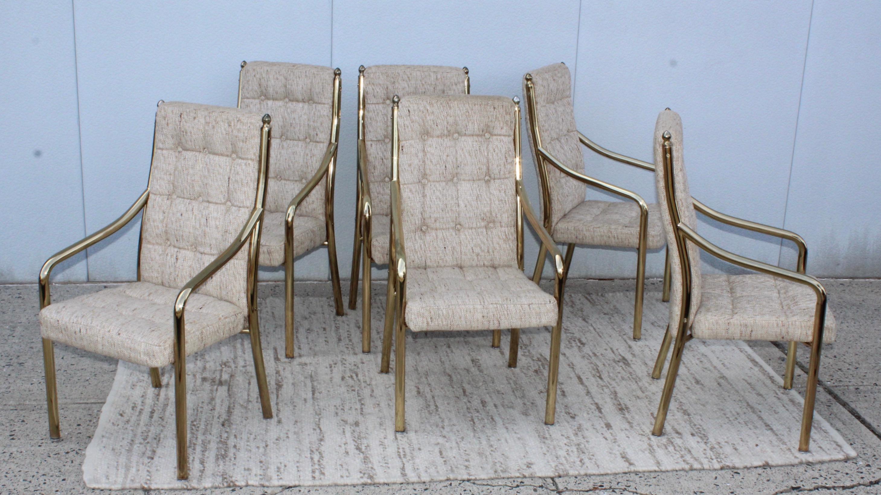 1980s modern very heavy metal with dining chairs with brass finish. In vintage original condition with original upholstery. With minor wear an patina to the brass.