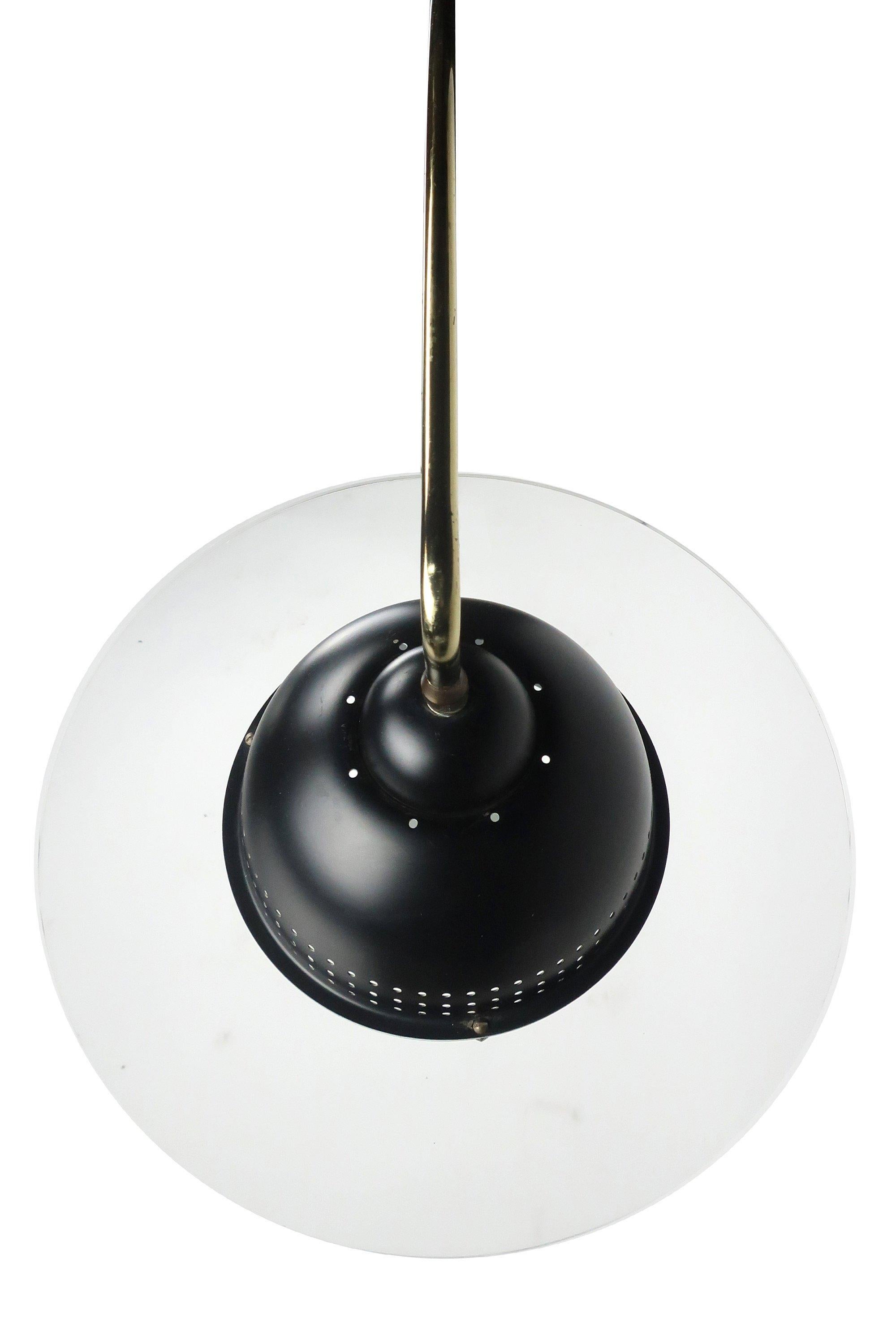 Known for Italian modern-inspired design and unusual shapes, Clover Lamp Company designed high quality commercial and residential lighting in the 1960s, 1970s, and 1980s
 
 This arc lamp has a cast iron base, brass arced stem, and black shade with