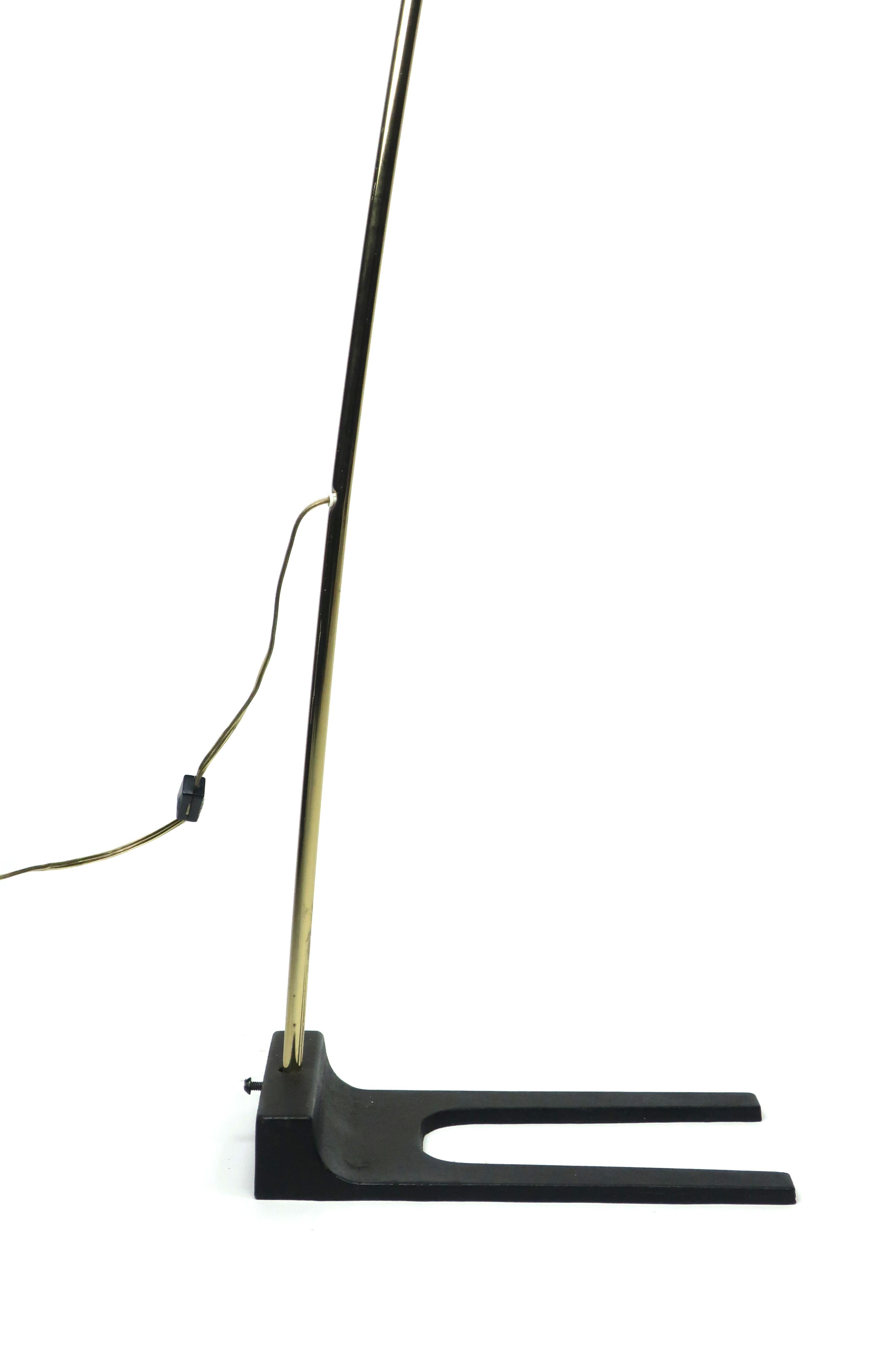 Known for Italian modern-inspired design and unusual shapes, Clover Lamp Company designed high quality commercial and residential lighting in the 1960s, 1970s, and 1980s.

This arc lamp has a cast iron base, brass arced stem, and black shade with