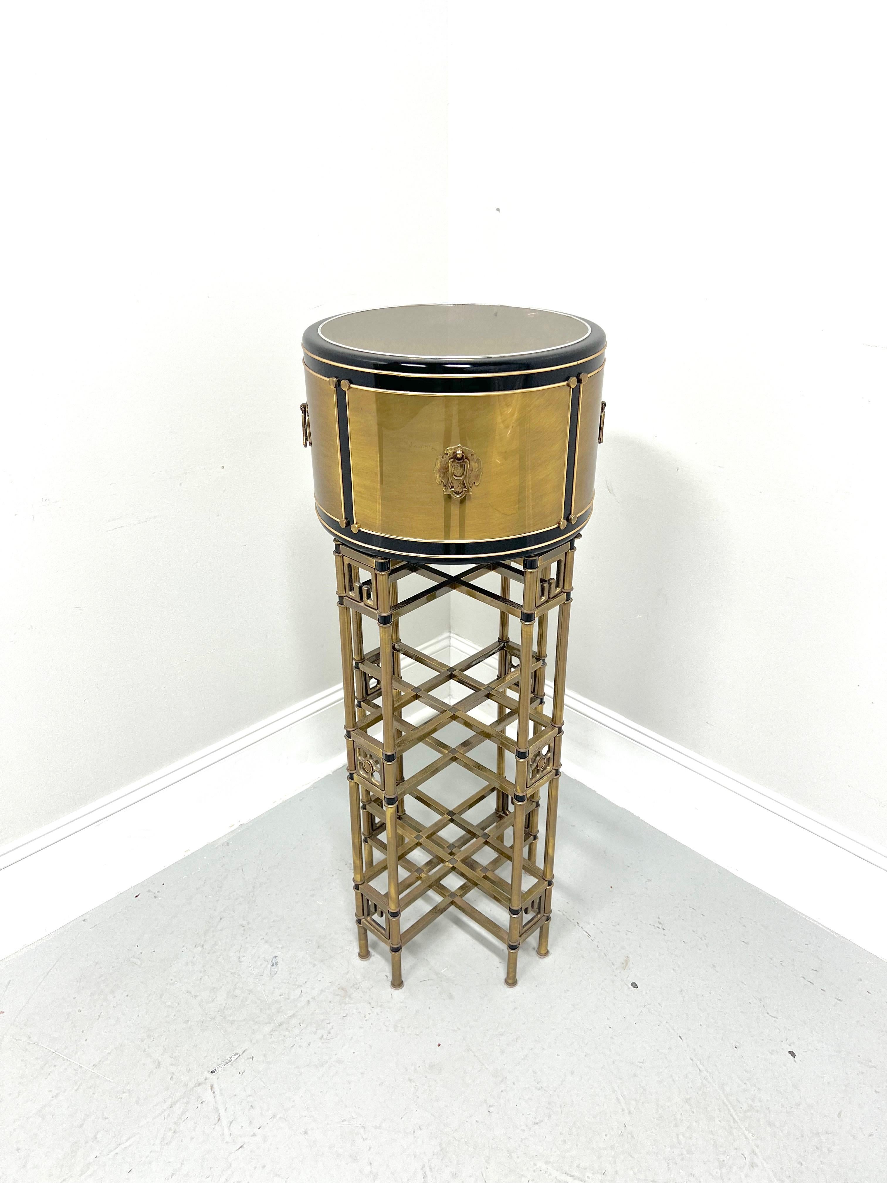 An Asian style plant stand, unbranded. Solid wood core to drum-shaped upper portion with plated brass & black enamel, brass accent hardware, lower portion with bamboo styling in a lattice design with black enamel accents, and cap feet. One piece