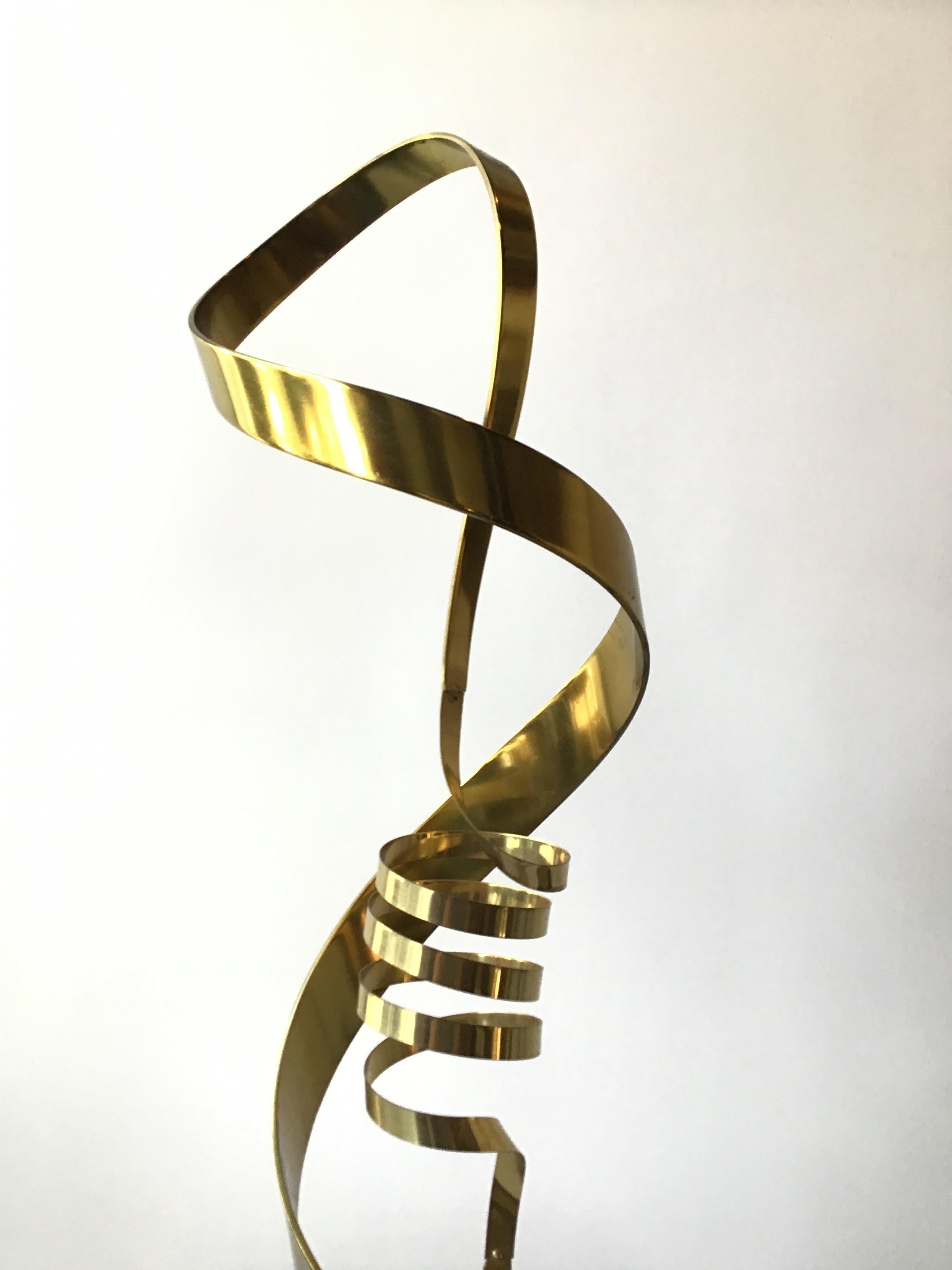 1980s brass ribbon abstract sculpture on marble base
Brass sculpture can turn on base.