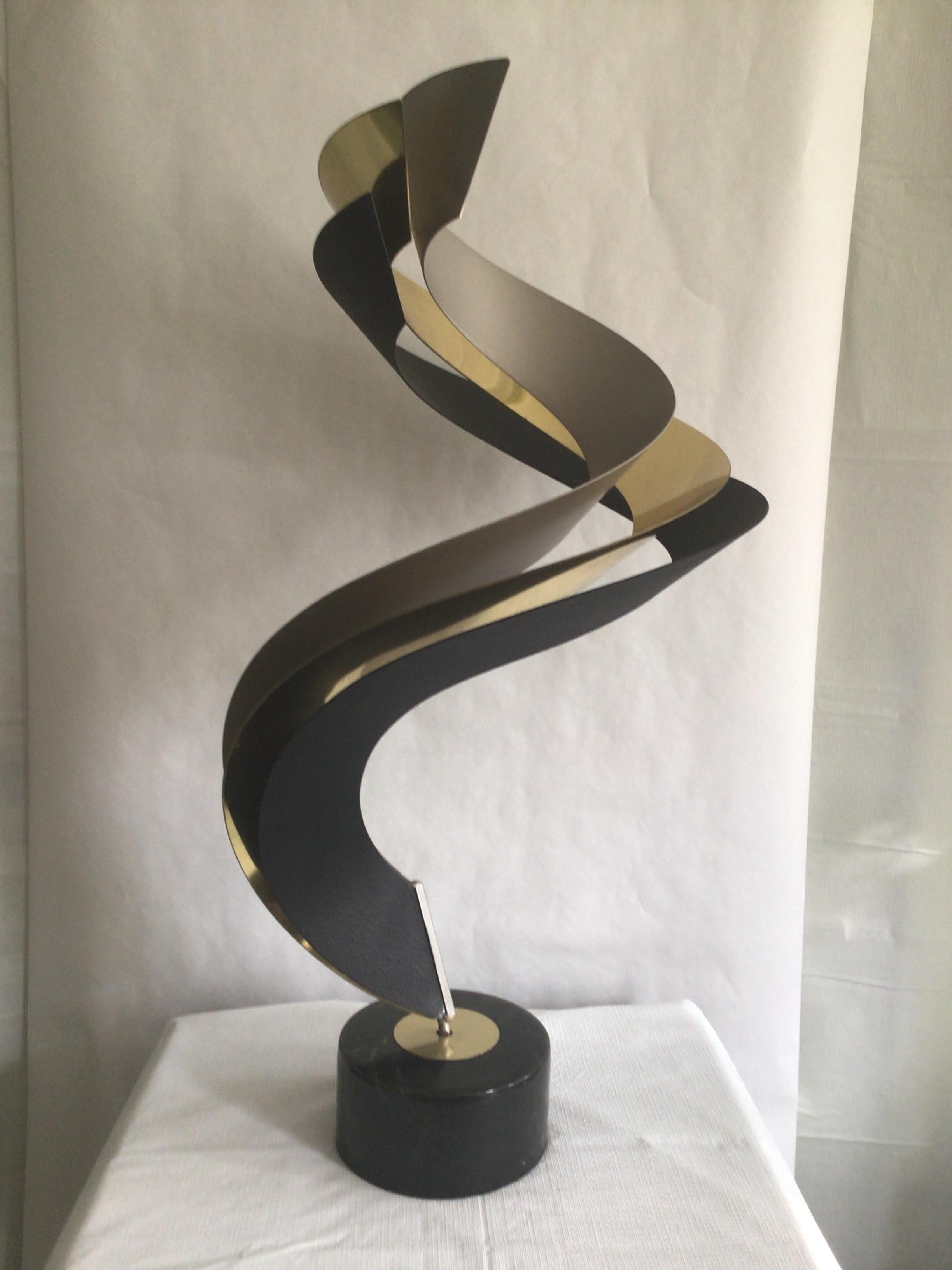 1980s brass steel and aluminum Swirled sculpture on Swivel base
Composition base swivels and turns 360degrees - weighted base.