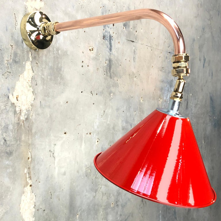British army tilting festoon lamp painted red fitted to a copper and brass cantilever wall fitting to create a bespoke wall light.

Professionally restored and converted by hand in UK by Loomlight to modern lighting standards, ready for contemporary