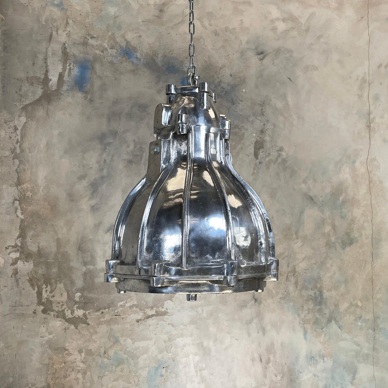 These large vintage cast aluminium flameproof ceiling pendant light fixtures are full of industrial character. Made by British manufacturer Crompton Lamps c1980, the large solid metal design and build make these fixtures perfect for large kitchens,