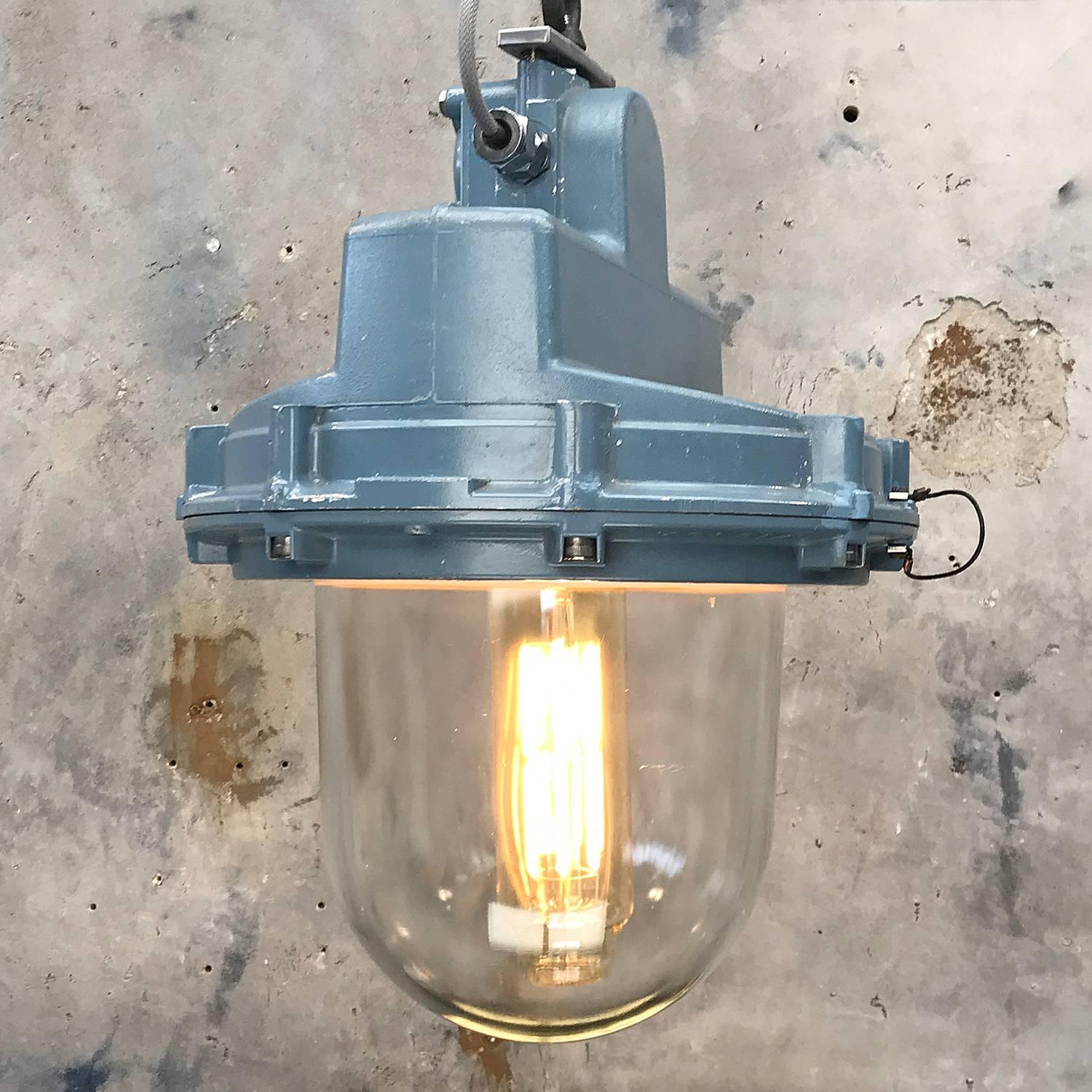 Victor Ex class pendant lighting reclaimed from an oil rig and used to illuminate hazardous areas.

Original blue paint finish.

British made in the 1950s, a substantial glass dome and two part aluminium enclosure originally housing a sodium