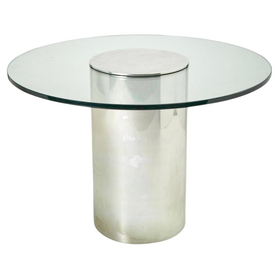 Table de salle à manger à piédestal cylindrique en chrome poli et verre de style Brueton des années 1980