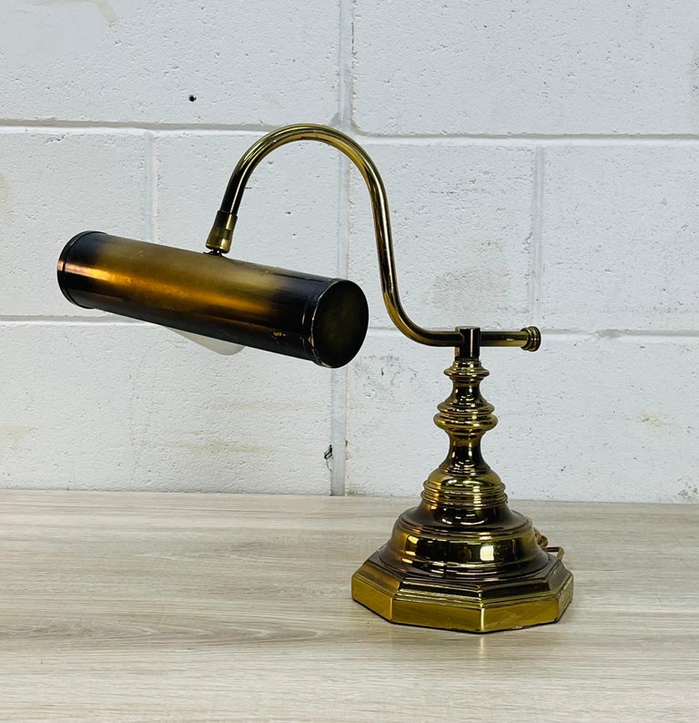 Vintage 1960s brushed brass desk lamp. Wired for the US and in working condition. Comes with the bulb. Base is a six-sided design. Shade is adjustable. No marks.