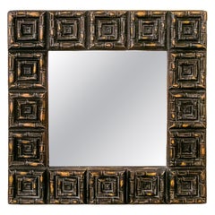 1980s Brutalist Black and Gold Mirror with Geometric Carved Frame