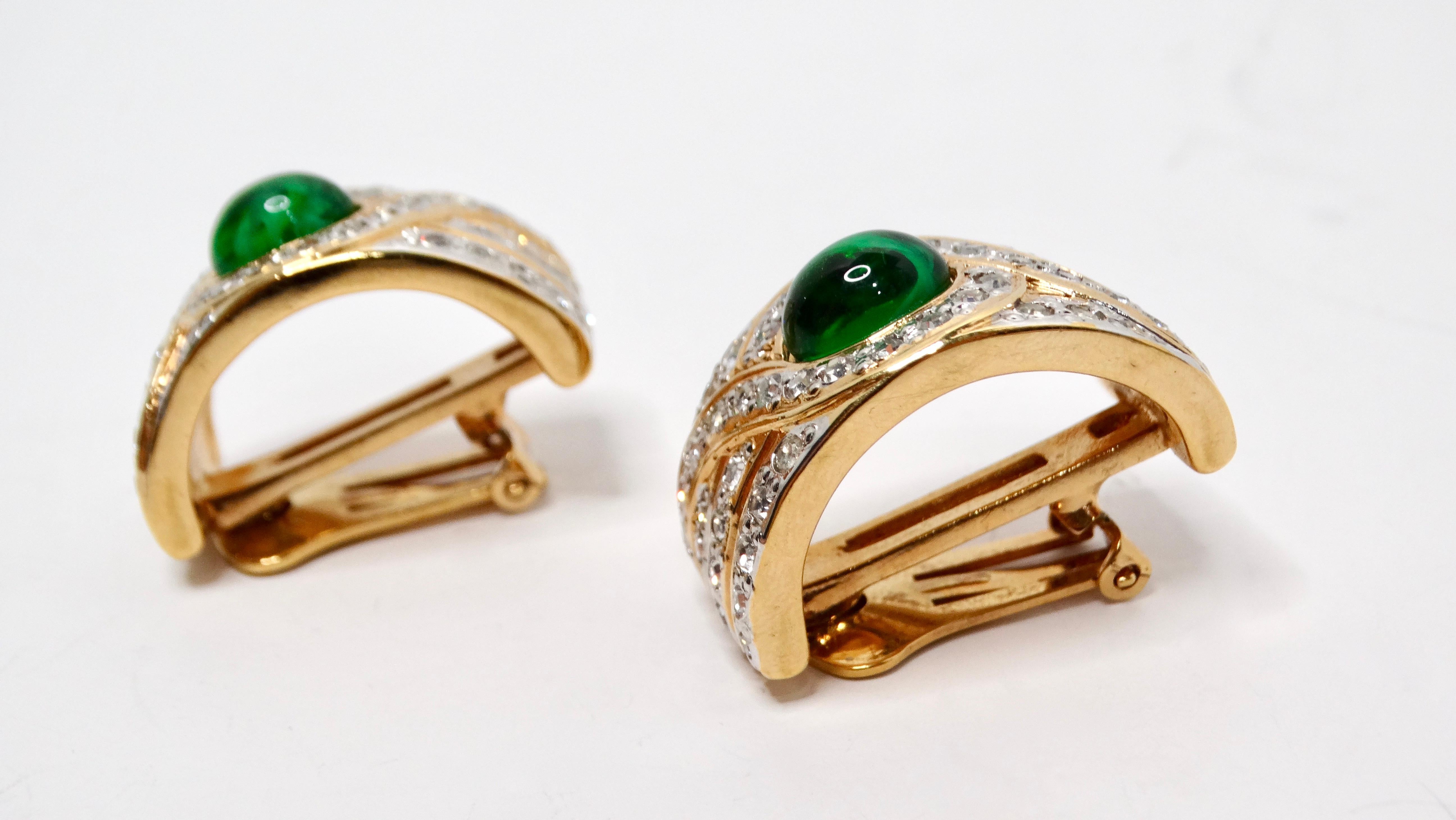 These exquisite 1980s Bulgari inspired statement earrings embody bold elegance, featuring a striking half hoop design that captures attention effortlessly. Crafted from lustrous 18k gold plating, these chunky earrings showcase a captivating green