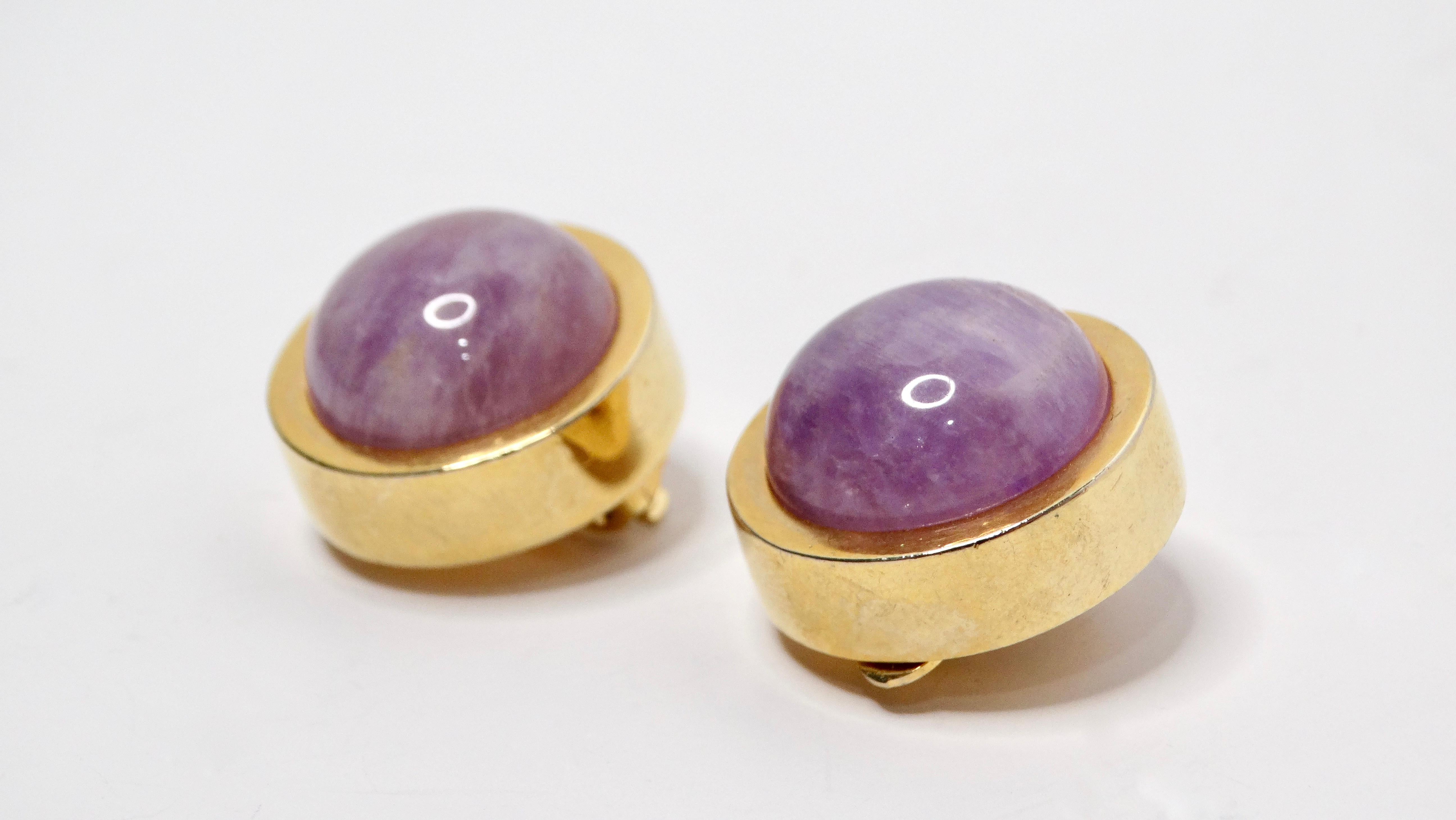 These exquisite 1980s Bulgari-inspired round purple stone earrings are a stunning testament to vintage elegance. Designed as clip-ons, these earrings feature a striking jade-like costume purple stone, elegantly surrounded by luxurious 18k gold