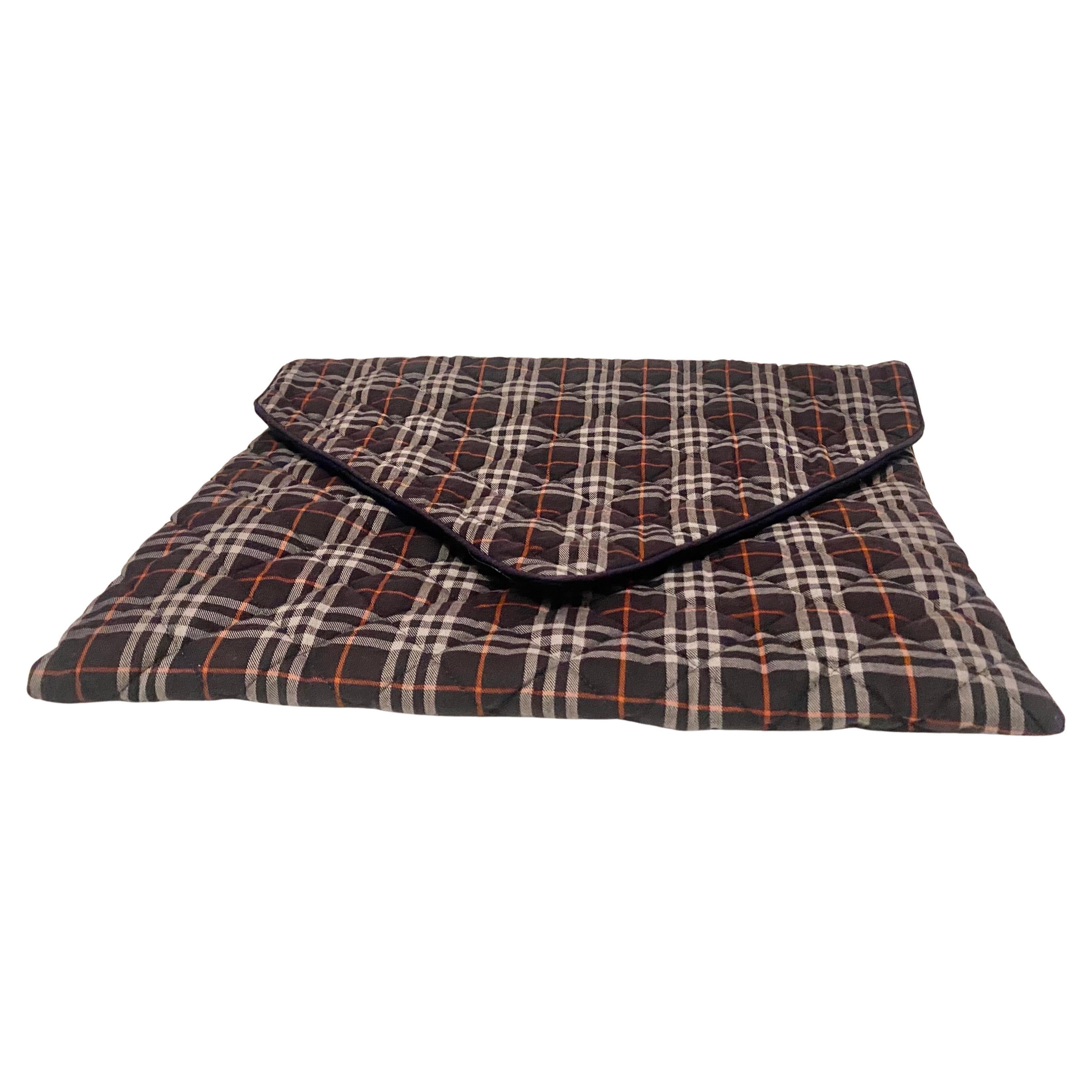 1980s  Burberry lingerie travel Computer Sleeve bag pouch in Blue Burberry Tartan, quilted and padded, with envelope style fold over flap, it t can be used as lingerie bag, travel bag, laptop sleeve and envelope bag. 

Condition: vintage, 1980s very