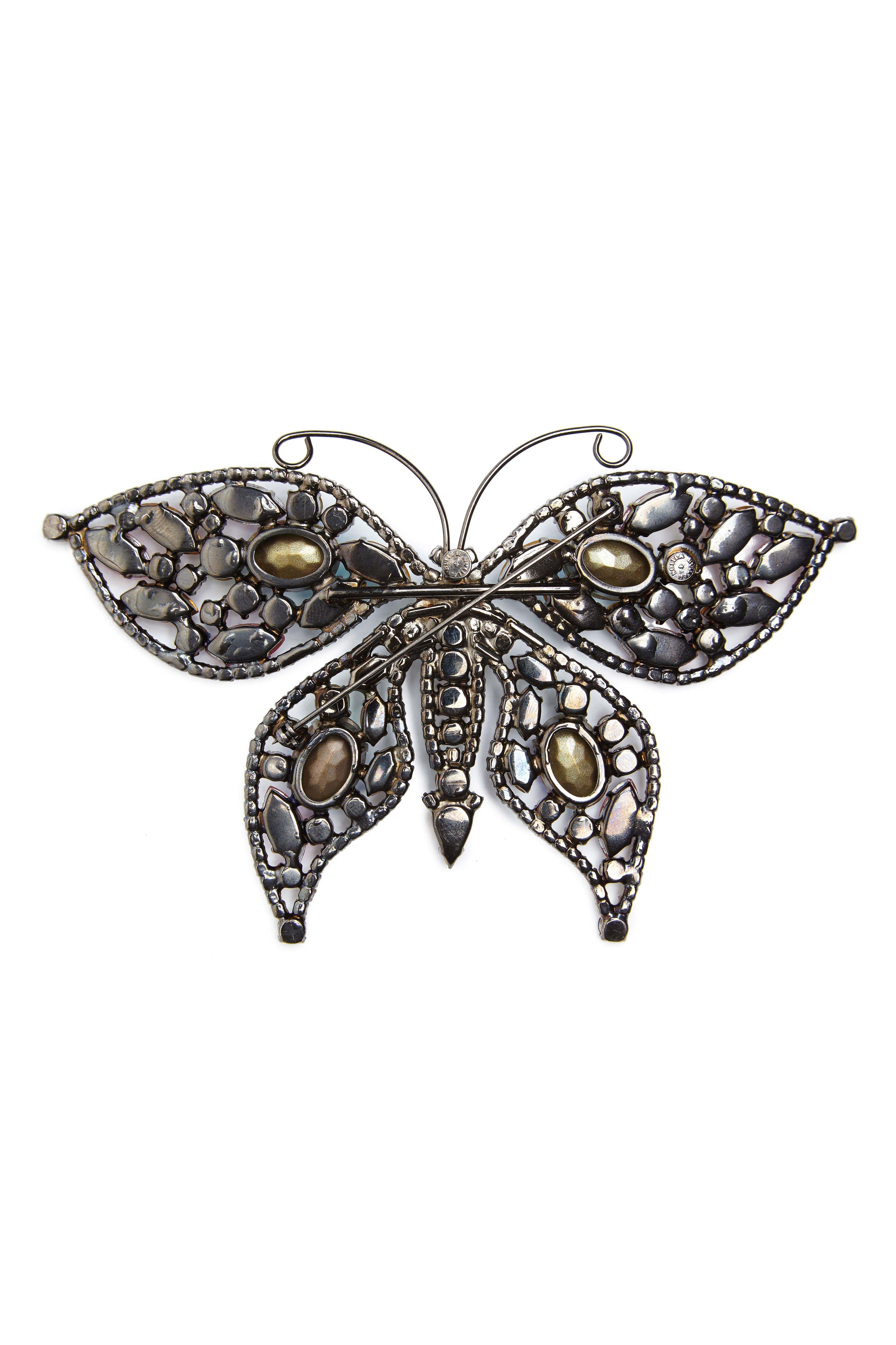 1980s Butler and Wilson giant Swarovski multicoloured crystal butterfly brooch. This is an original, collectable and early design that is entirely prong set with a variety of classic facet shaped and moulded iridescent stones and has a thick gun
