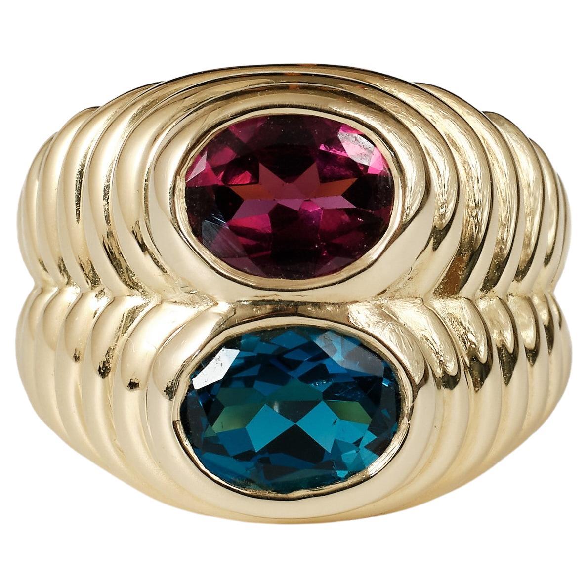 1980er Bvlgari doppio-Ring aus 18 Karat Gold mit blauem Topas und Rhodolith 