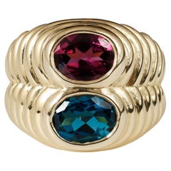 1980s Bvlgari 18 karat gold blue topaz and rhodolite doppio ring