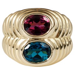 1980er Bvlgari doppio-Ring aus 18 Karat Gold mit blauem Topas und Rhodolith 