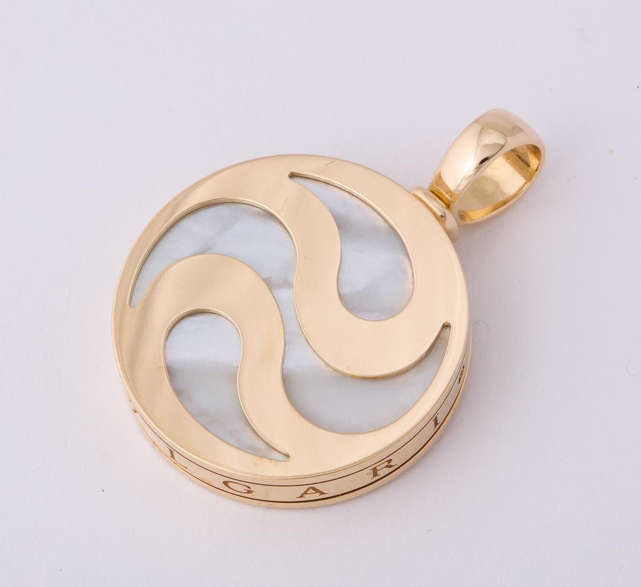 One 18kt Yellow Gold Spinning Pendant Created With A Mother Of Pearl Disc Which Moves When Spun. Made By Bulgari In The 1980's.