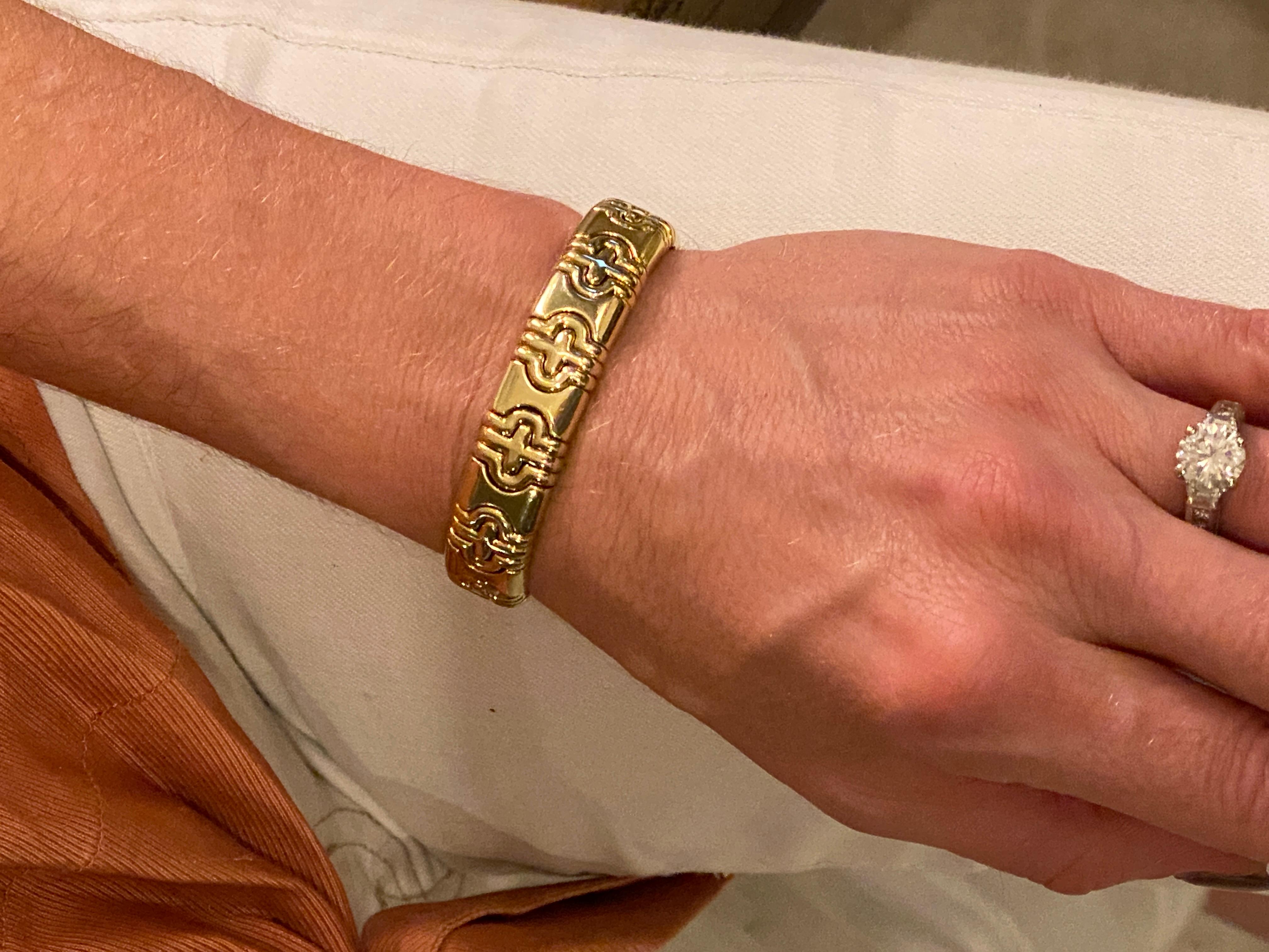Fabulous vintage Bvlgari cuff bracelet fashioned in solid 18 karat yellow gold. The bracelet is part of the Parentesi collection circa 1980's. The cuff is for a small wrist measuring 2.0 inches in diameter, and approximately 6.5 inches in