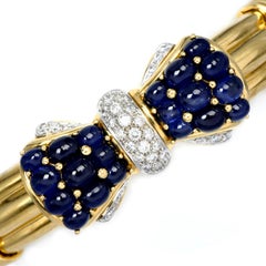 1980's Cabochon Blue Sapphire Diamond 18K Gold Bow Cuff Bangle Bracelet