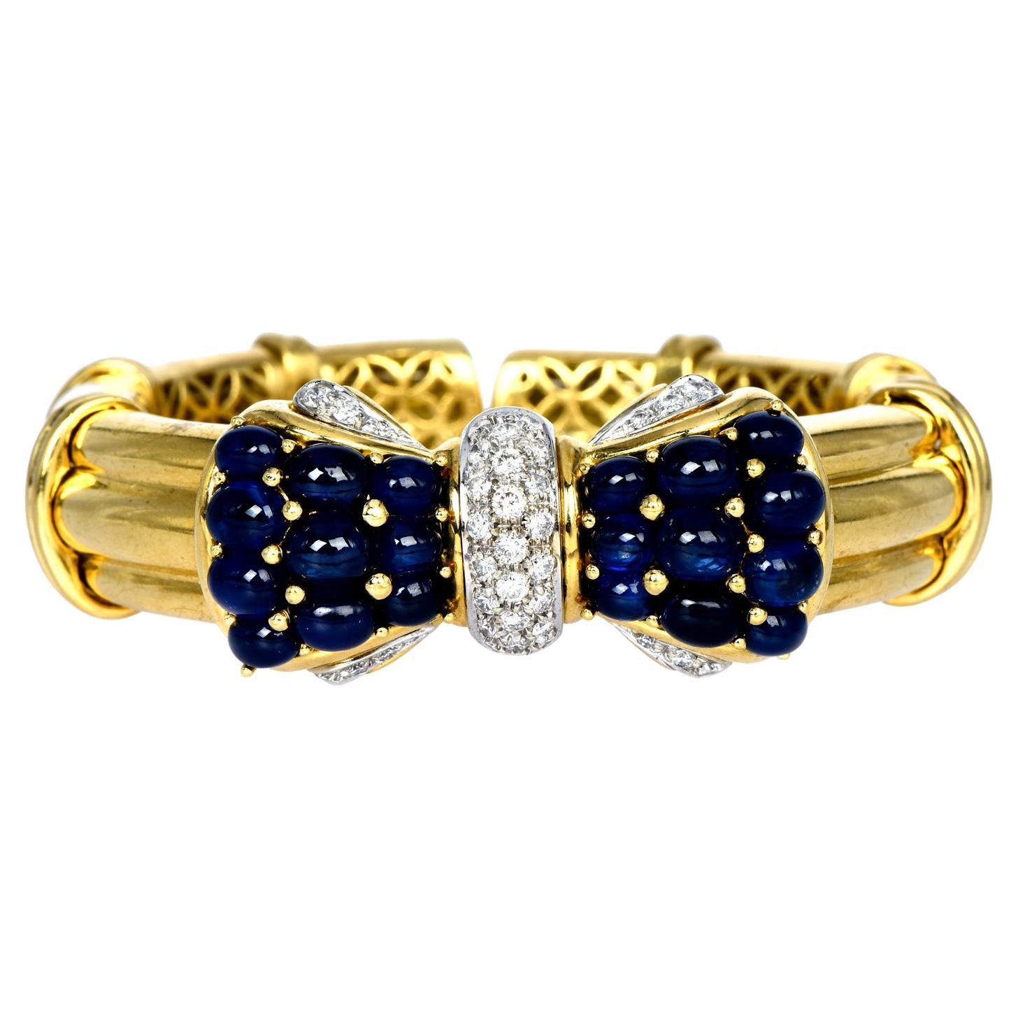 1980's Cabochon Blue Sapphire Diamond 18K Gold Bow Cuff Bangle Bracelet For Sale
