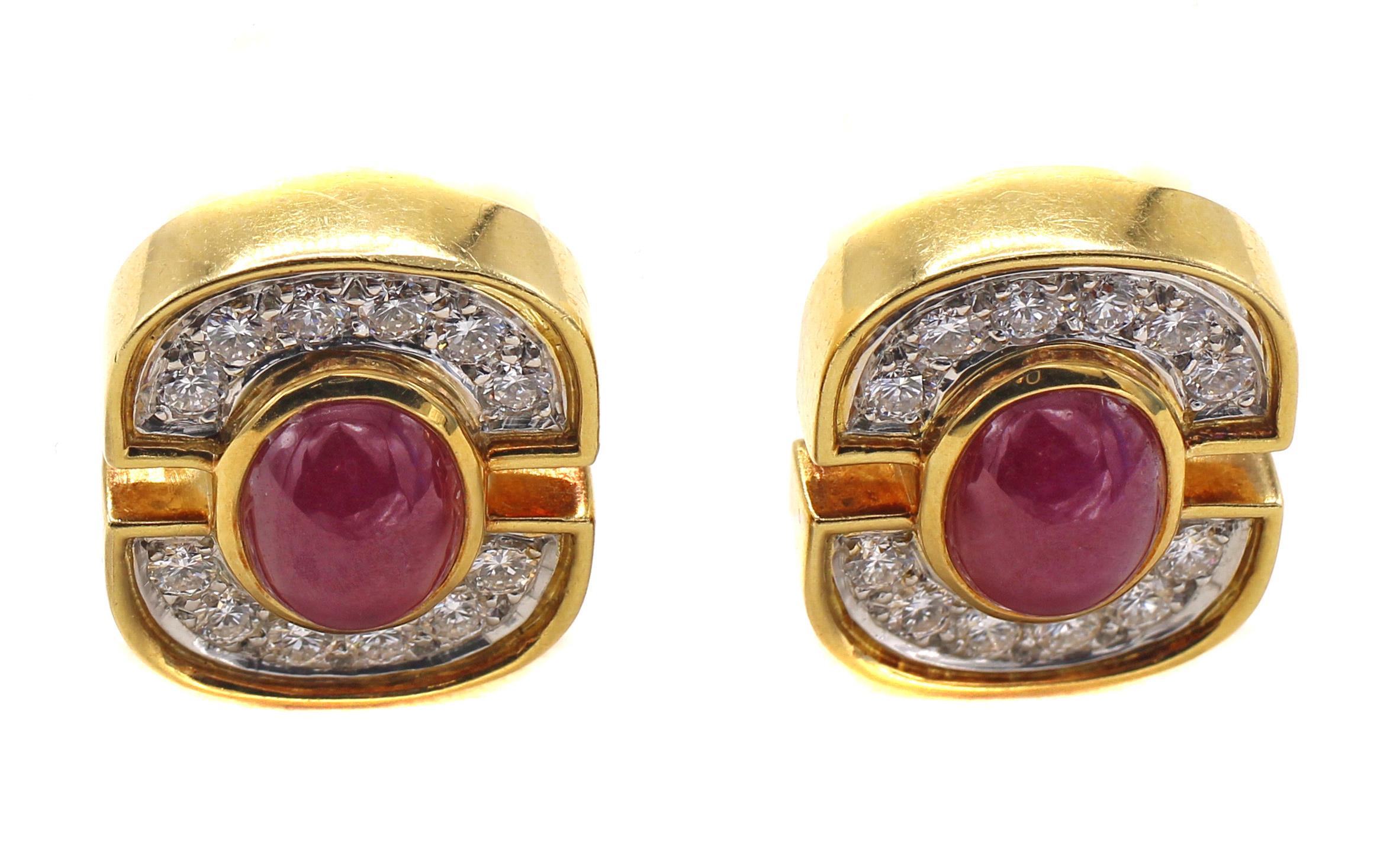 Chic 1980s yellow gold diamond ear clips set with 12 perfectly matched bright white and sparkly round brilliant cut diamonds in each ear clip centered by a bezel set oval cabochon ruby.