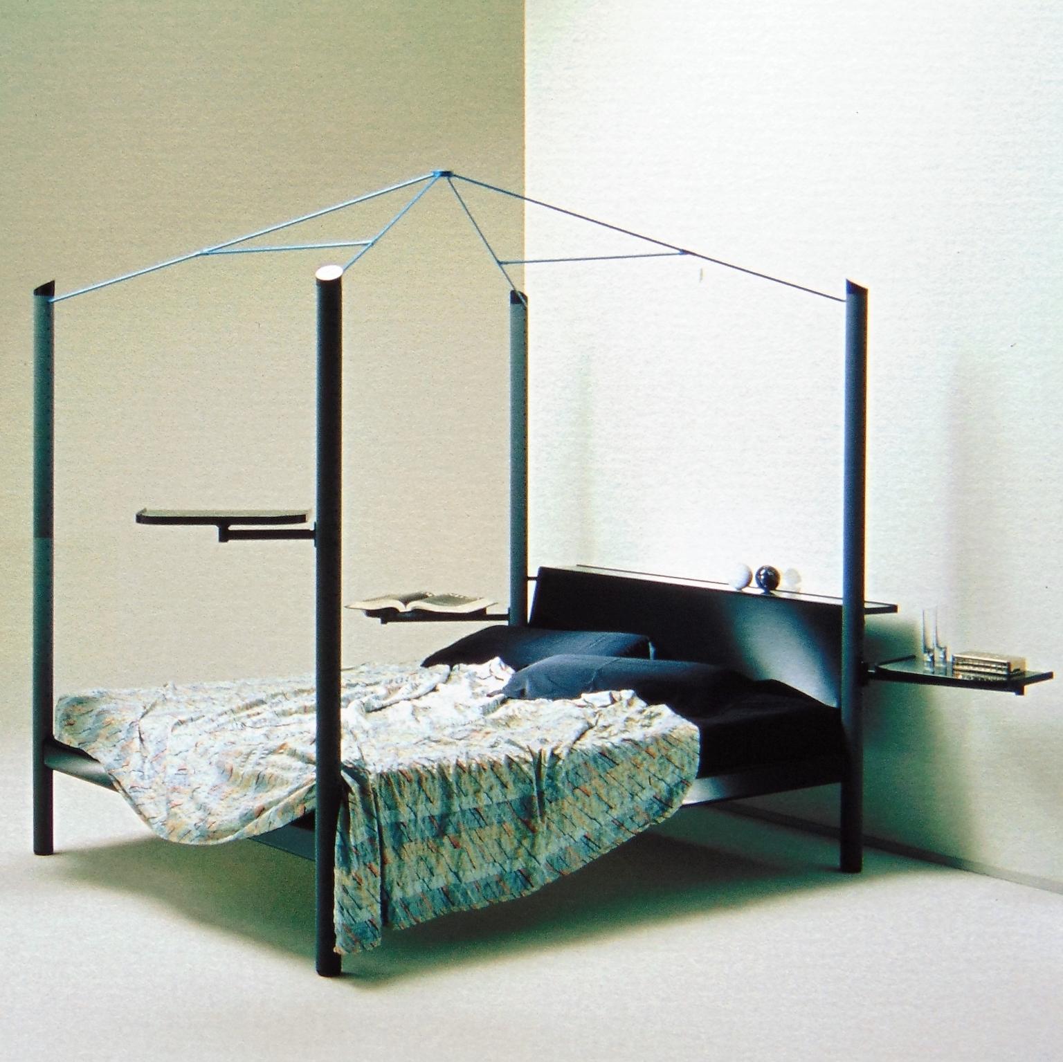 An unusual canopy bed, named Fauno, manufactured by Sormani in very dark green (almost black) glossy lacquer, with 4 columns in grey nextel and a metal canopy in light apple green. The bed has multifunctional structures all around: two trays that
