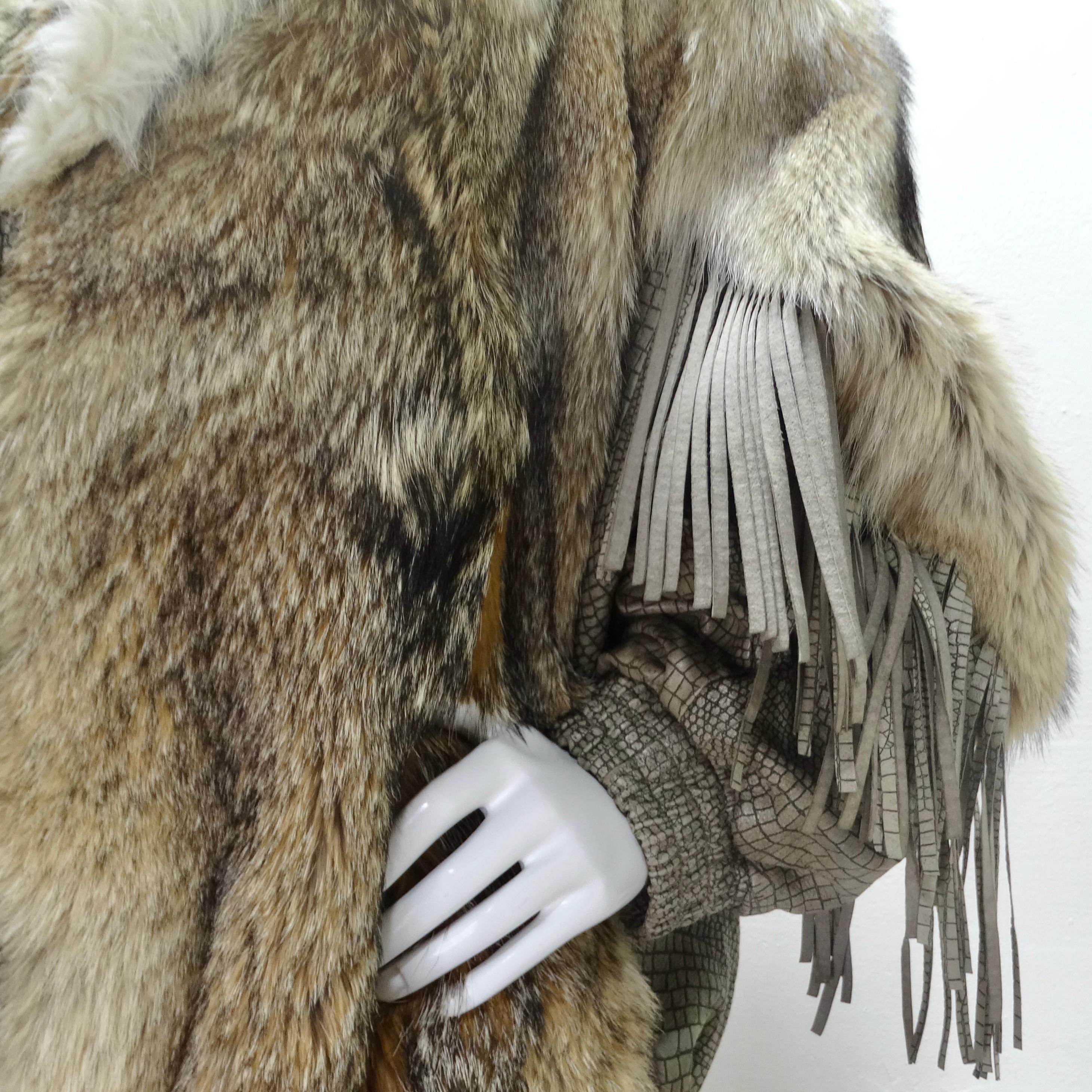 Introducing a jacket that doesn't just keep you warm but makes a bold statement in fashion - the 1980s Carlo Palazzi Coyote Fur Leather Fringe Jacket. This luxurious piece features coyote fur contrasted with light brown leather fringe, creating a