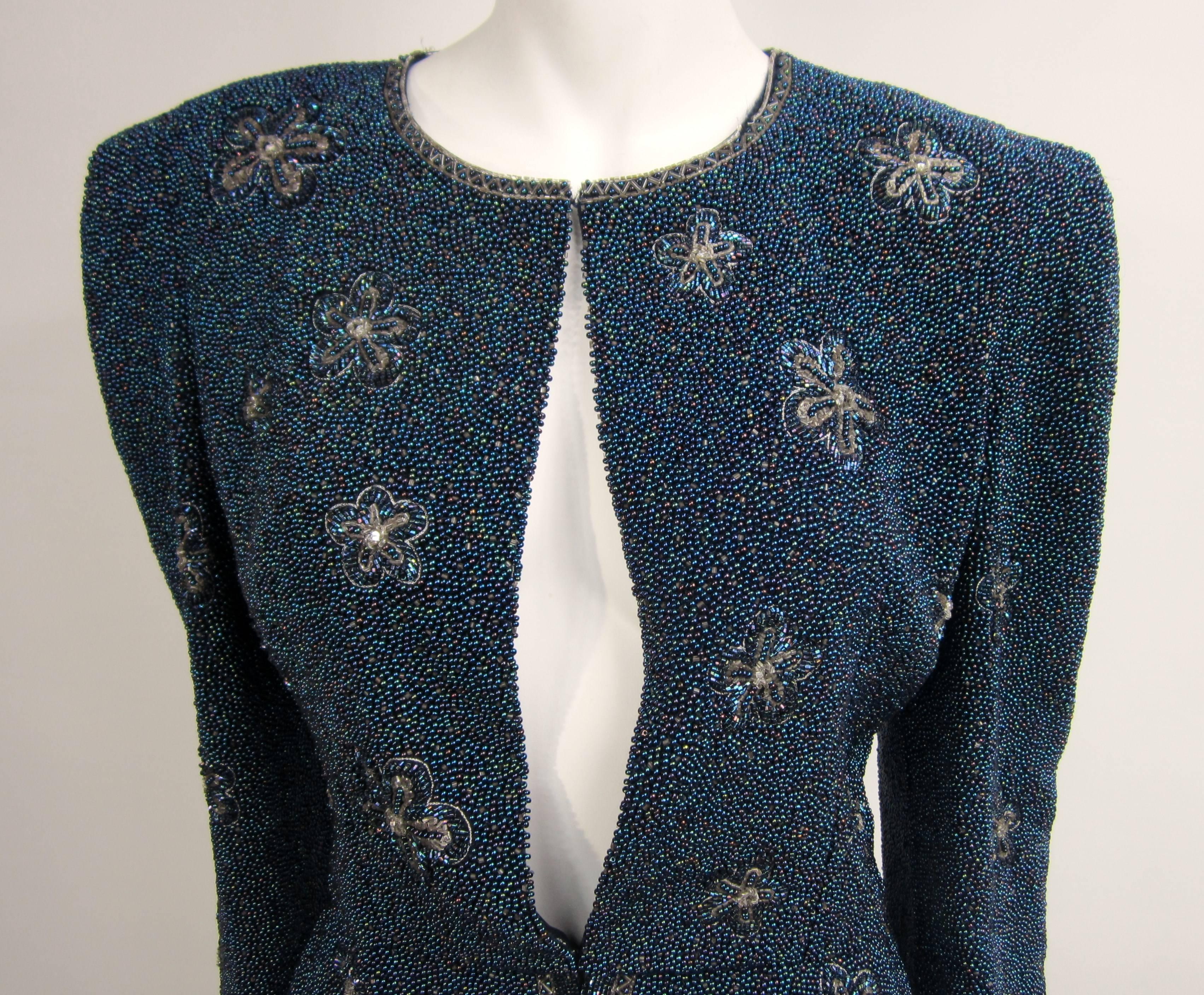 Totally beaded Carolina Herrera Jacket. The entire jacket is covered in stunning aurora borealis beading. Scalloped hem. 2 clip closure. Will fit a 2-4 Measuring Up to 34-inch bust, up to 29-inch waist and length is 22 inches. XS. Labeled an 8