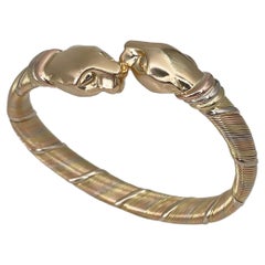 1980s Cartier 18 Karat Tri-Color Gold Double Head Panther Cuff Bangle Bracelet