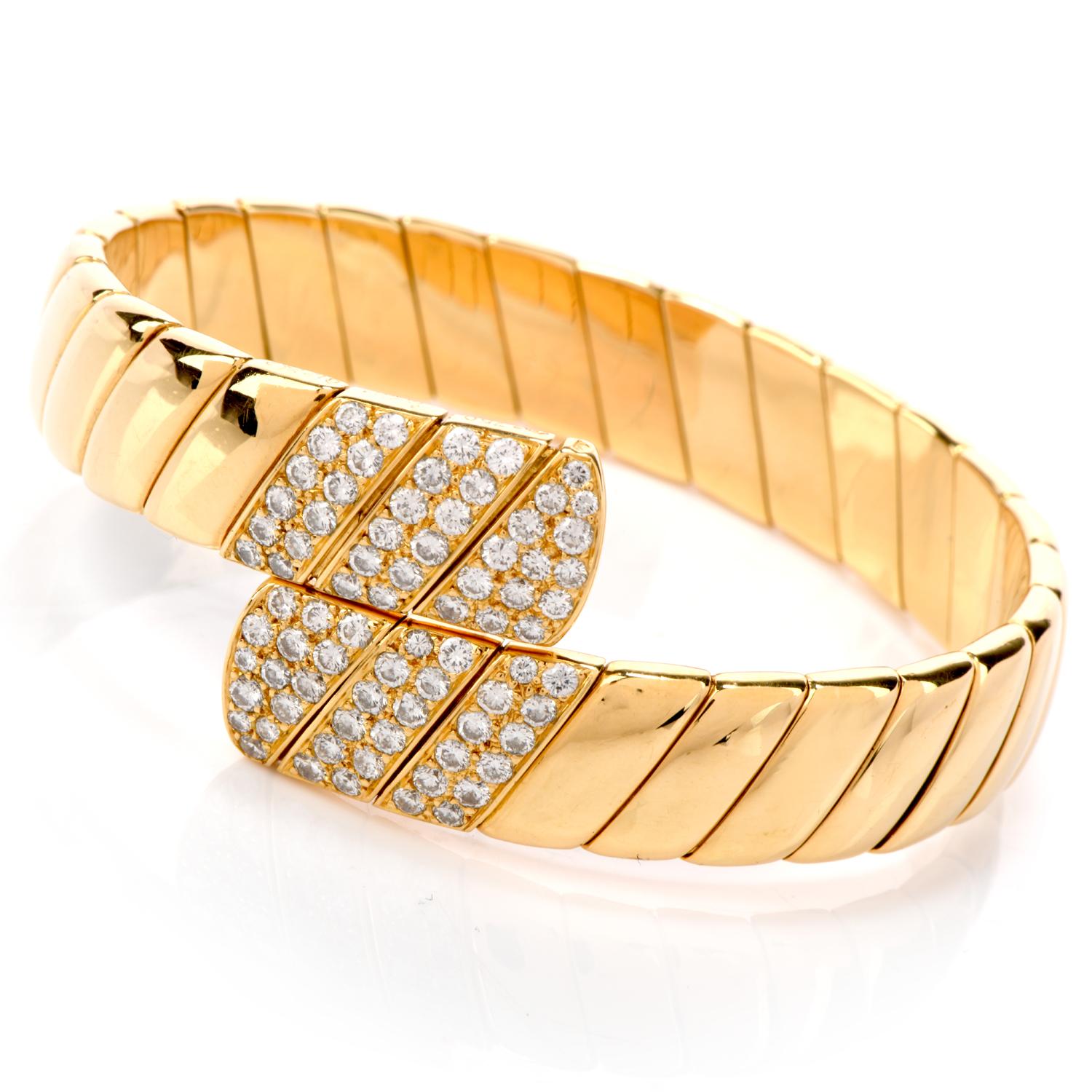 Decorate your wrist tastefully with this 1990's  Cartier 18K Gold Bypass diamond Cuff Flexible Bracelet.  This bracelet is

stretchable for your comfort, made from quality 18 karat yellow gold of a 90s textured design.  Weighs at a substantial 65.3