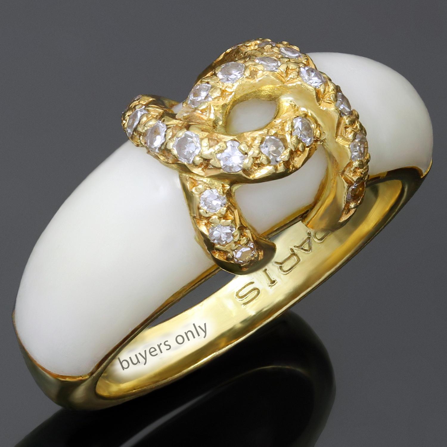 The classic antique Cartier ring is crafted in 18k yellow gold and accented with a carved white coral and single-cut diamonds weighing an estimated 0.25 carats. Marked Cartier and completed with French hallmarks. Made in France circa 1970s.