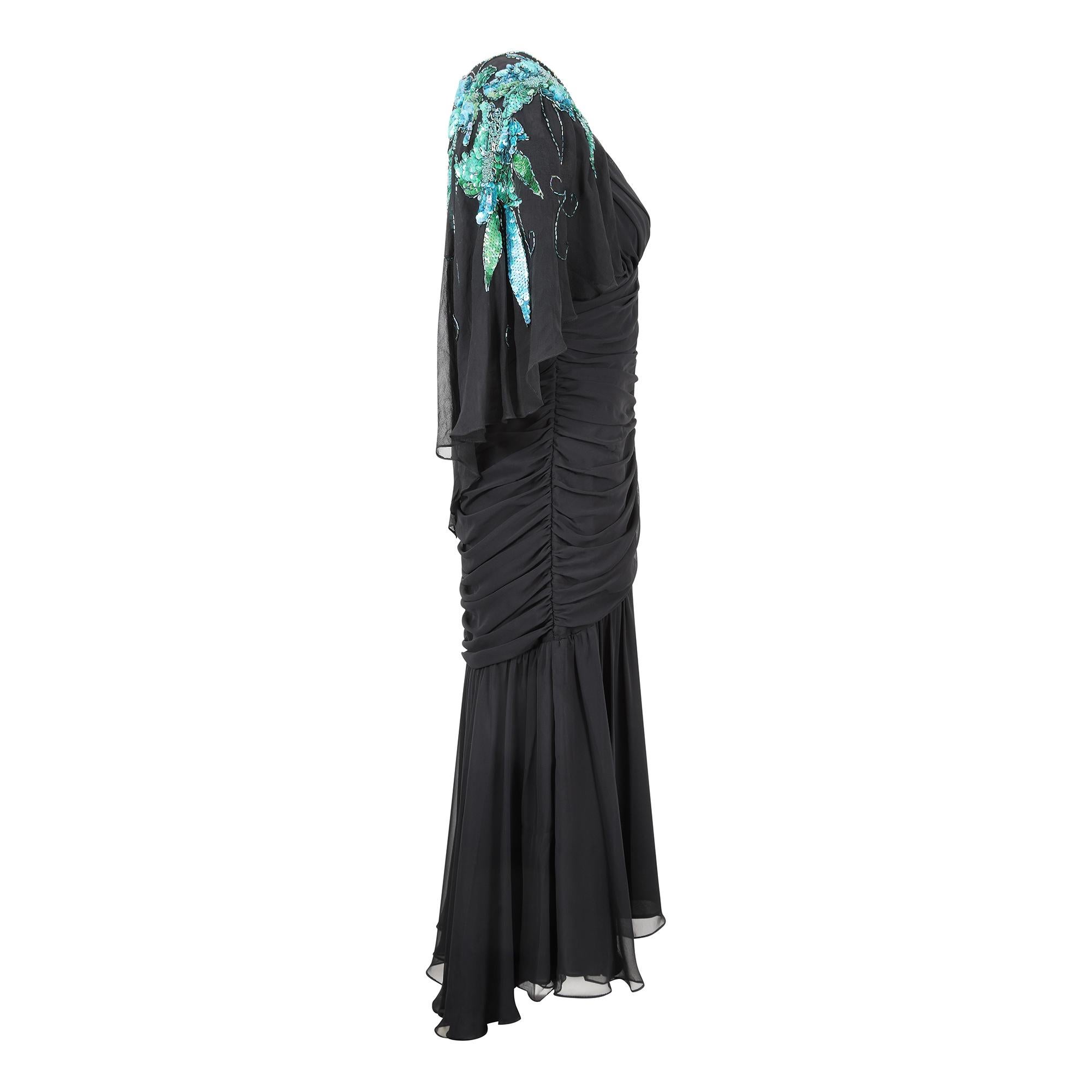 This is a super sexy 1980s Casadei black stretch chiffon dress with front ruching and a turquoise sequinned attached capelet. Typical of its era, this dress has such great design features especially the flattering draping and ruching as well as the
