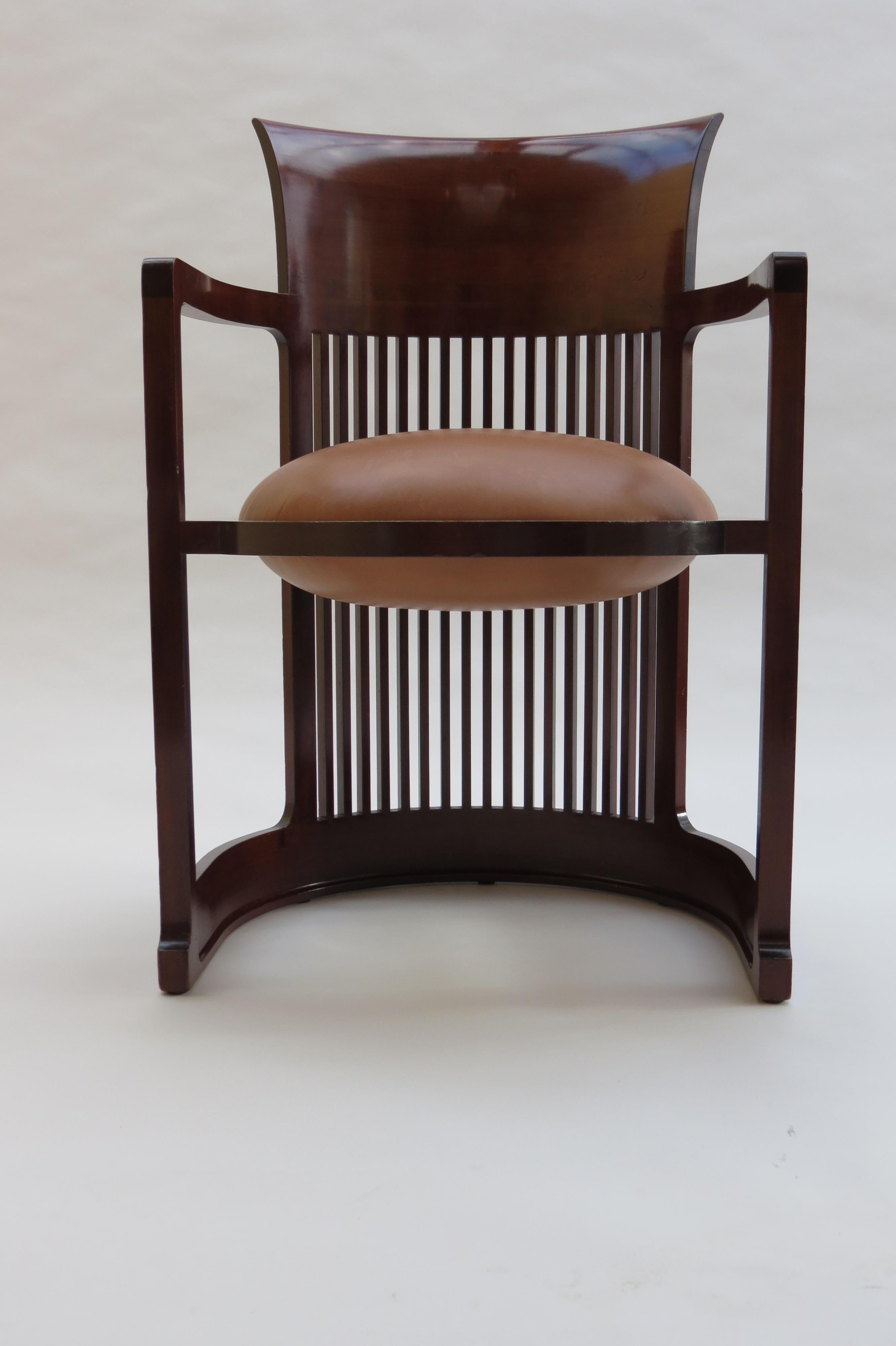 A Taliesin Barrel chair, designed by Frank Lloyd Wright and produced by Cassina.
This design classic was produced in 1986 and is made from solid Cherry wood and a newly recovered ball seat cushion in leather.
The chair retains the original makers