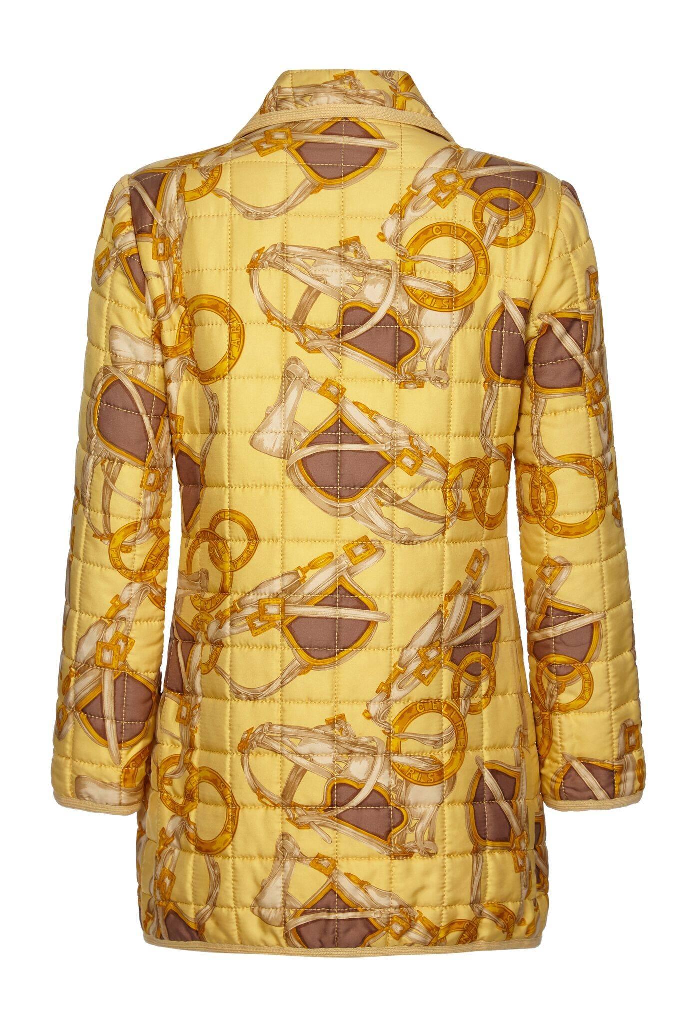 This stylish 1980s printed silk yellow quilted jacket by Celine is in beautiful condition and exudes casual chic. The distinctive equestrian printed silk is subtly emblazoned with the designer's logo in ash brown, soft ochre and gold tone over a