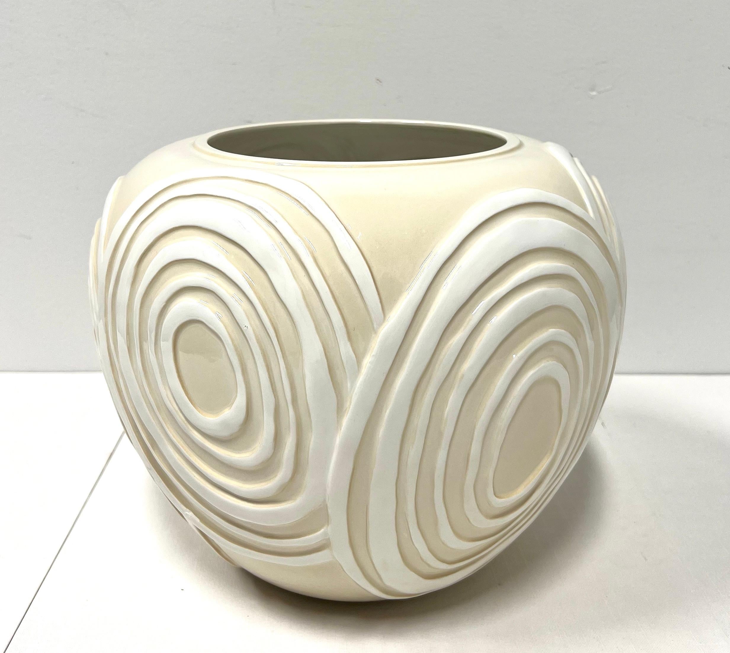 A Contemporary style decorative ceramic centerpiece bowl, unbranded. Beige in color with white swirl patterns throughout. Origin unknown, circa 1980's.

Measures:  11w 11d 9.5h, Weighs Approximately: 4 lbs

Outstanding vintage condition with signs