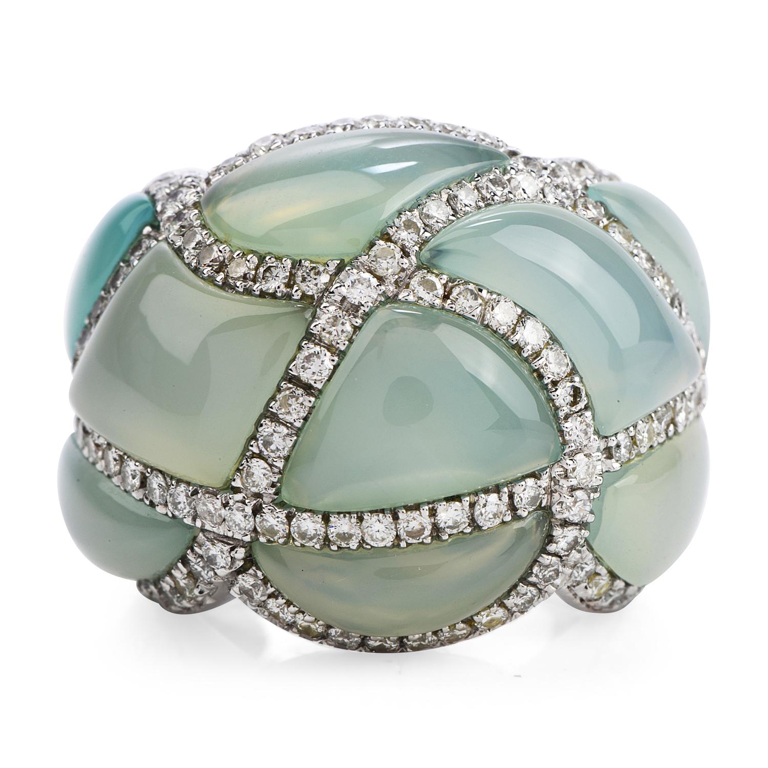 This regal design will captivate everyone.

Featuring 9 large pieces of cabochon cut aquamarine accented by a criss cross pattern throughout of round brilliant cut diamonds.

Some 145 natural diamonds weigh cumulatively appx. 1.54 carats

and all