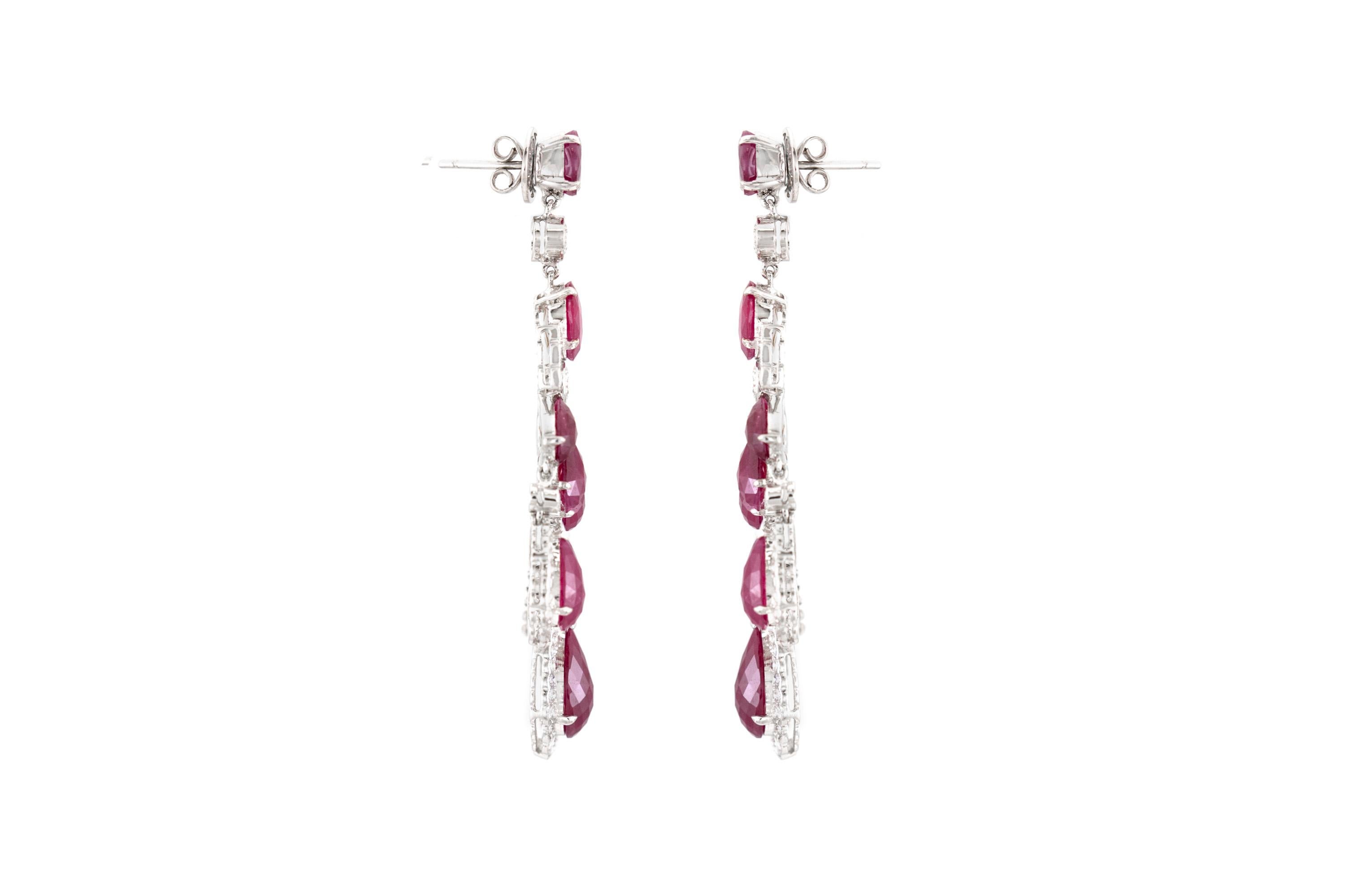 The earrings are finely crafted in 18k white gold with diamonds weighing approximately total of 4.19 and rubies weighing approximately total of 27.6 carat.
Citrca 1980