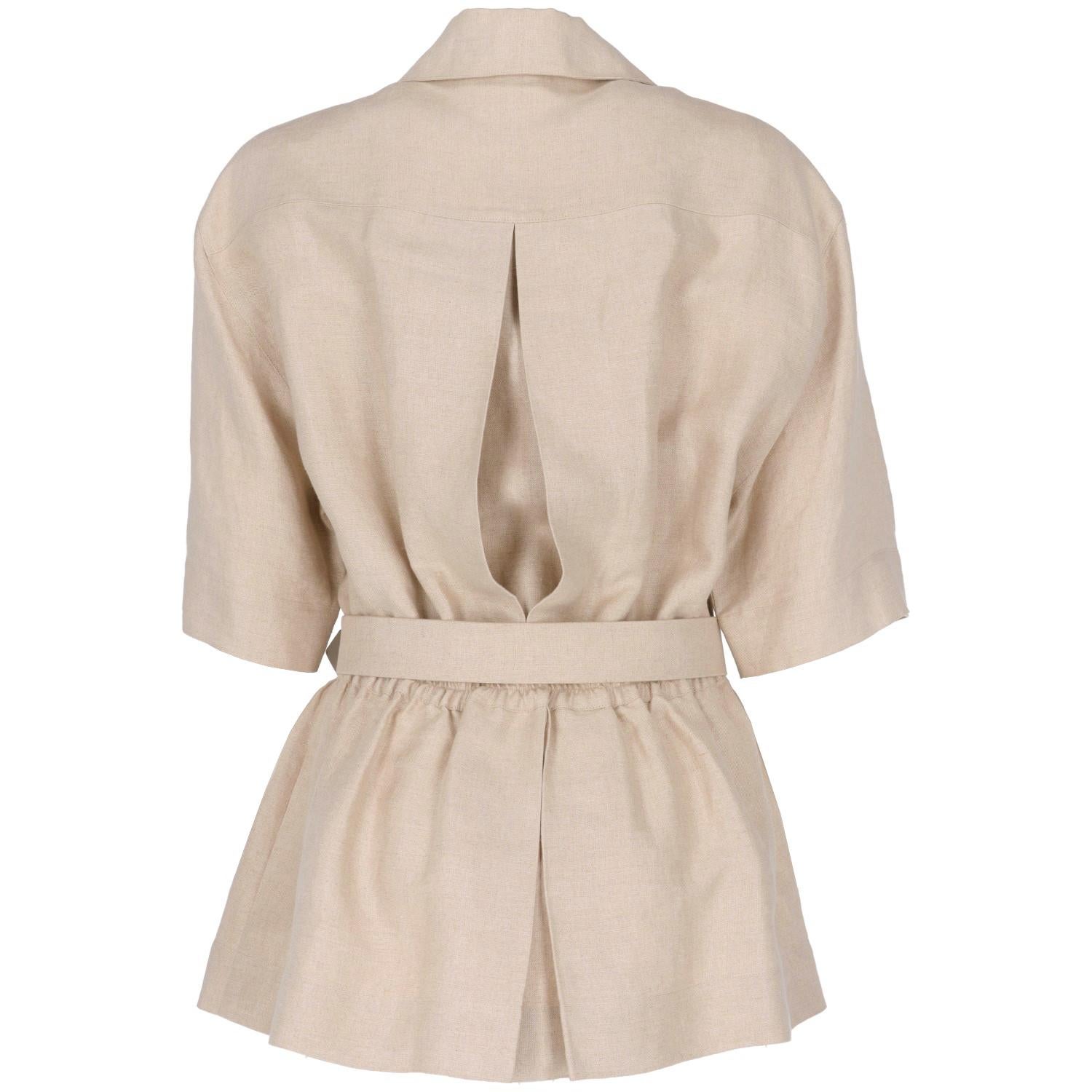 
Chanel sophisticated beige blend silk and linen belted jacket, featuring a loose cut with highlighted waistline. 
Feminine pleated collar and gold-tone metal buttons with a beautiful quilted texture, short sleeves, two patch pockets on the chest