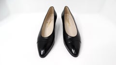 1980s Chanel Black Leather Chevron Cap-Toe Kitten Heels