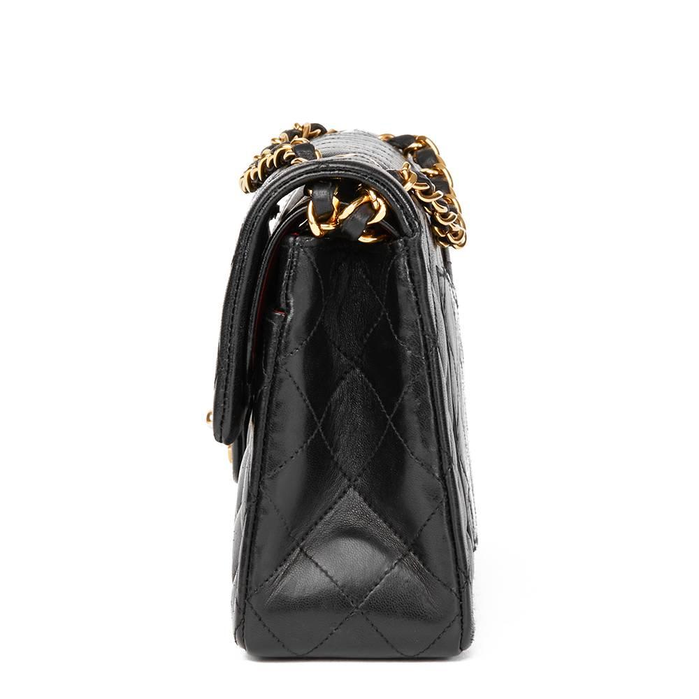CHANEL
Black Quilted Lambskin Vintage Small Classic Double Flap Bag

This CHANEL Small Classic Double Flap Bag is in Very Good Pre-Owned Condition accompanied by Chanel Dust Bag, Box. Circa 1986. Primarily made from Lambskin Leather complimented by