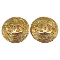 1980s Chanel Gold Tone CC Logo Textured Round Clip On Earrings