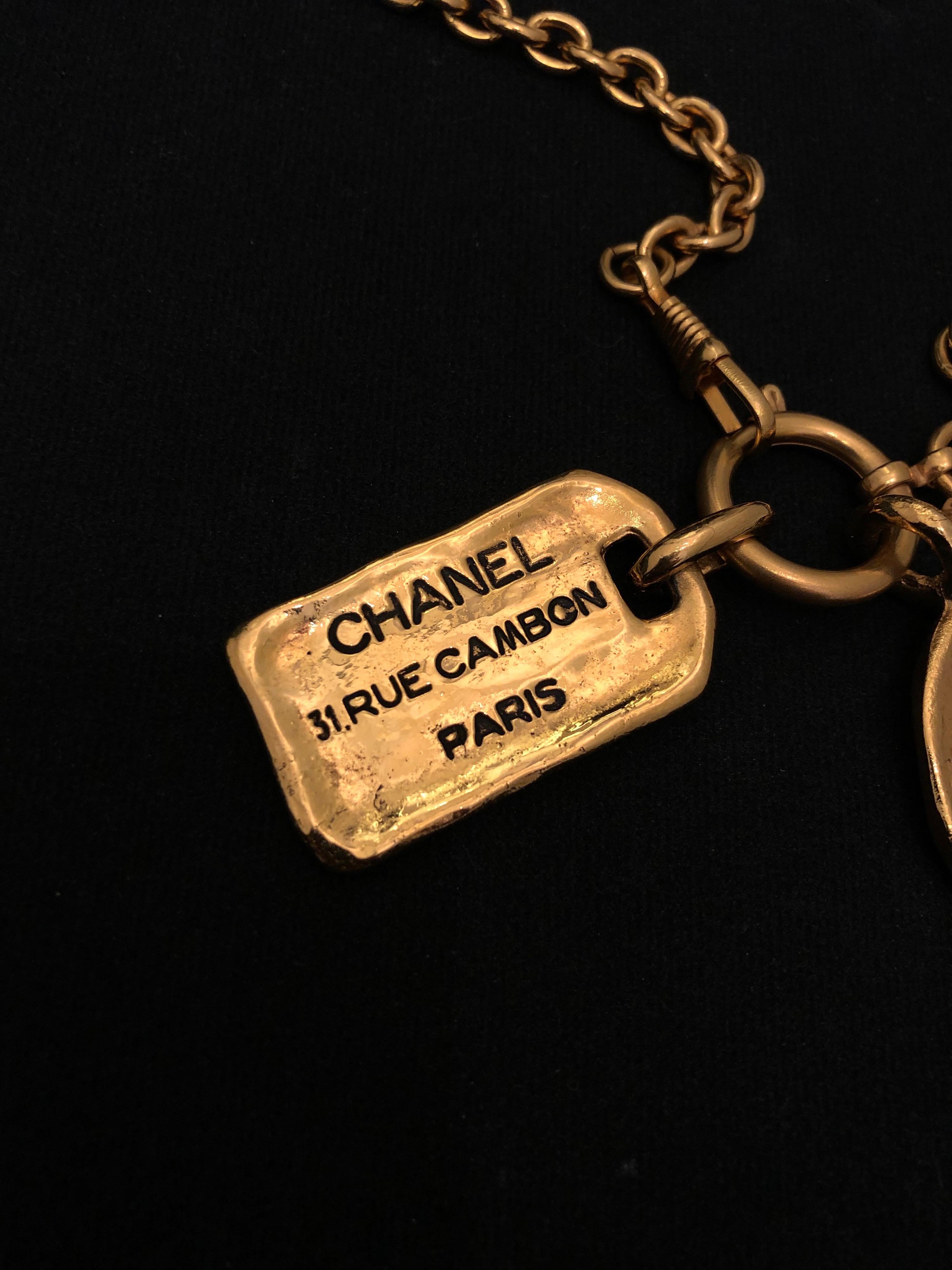 Women's or Men's 1980s Vintage Chanel Gold Toned 31 Rue Cambon Charm Necklace 